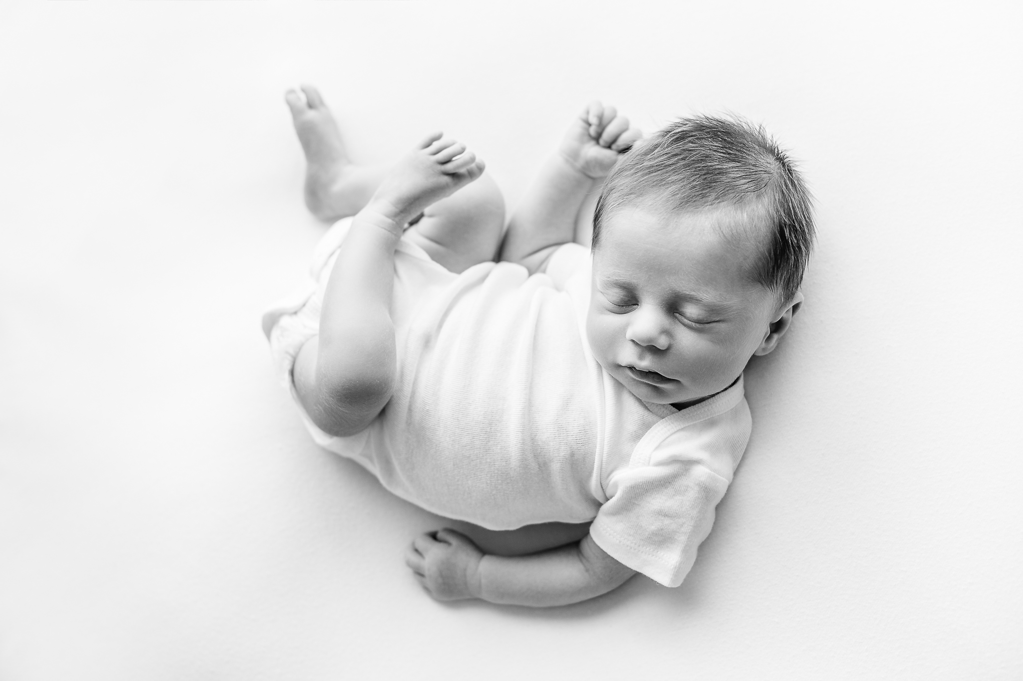 Black and white newborn baby onesie photo in Central Ohio