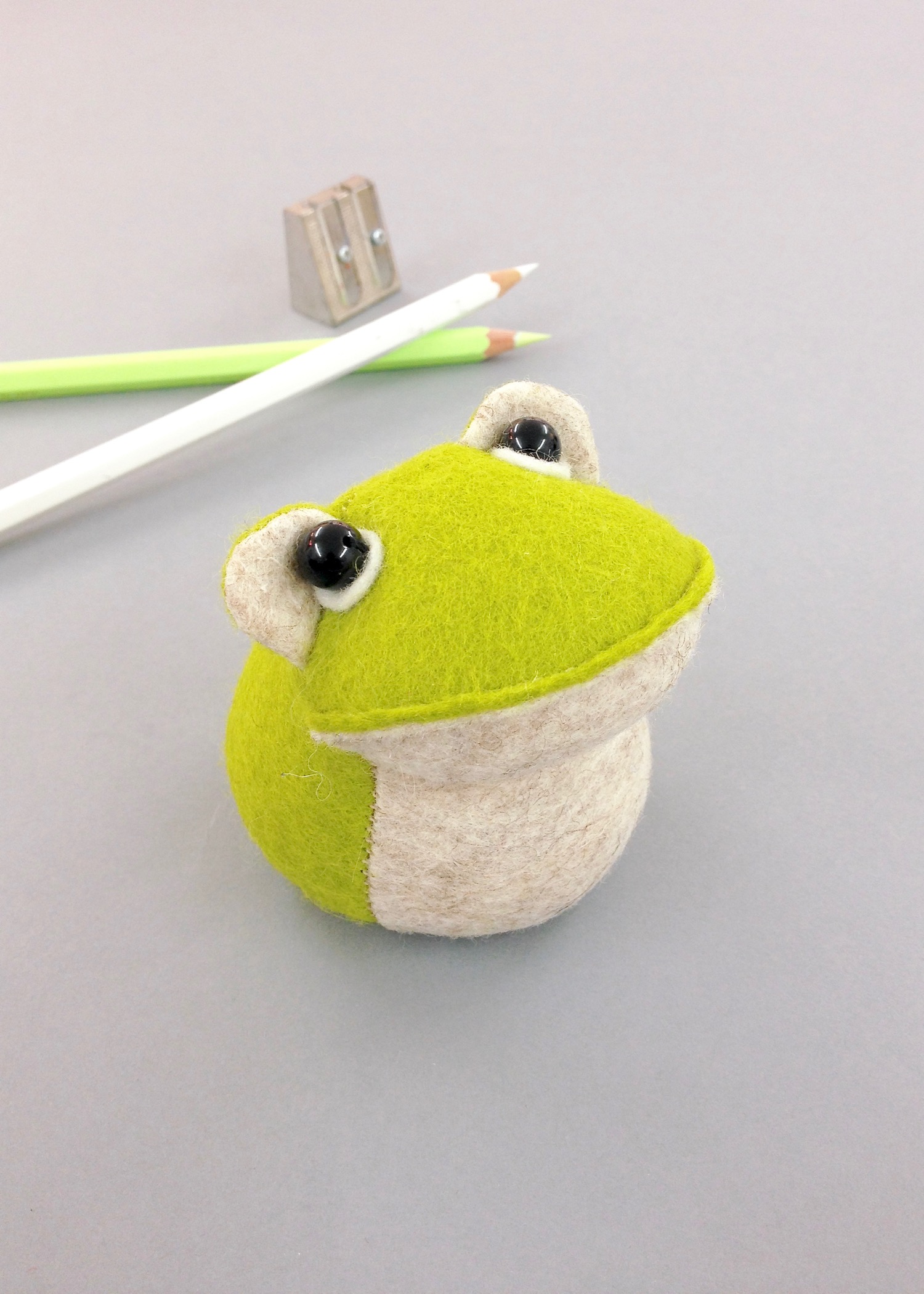 Bilberry Woods character Croaker the Frog as a cute felt paperweight handmade by Laura Mirjami | Mirjami Design.
