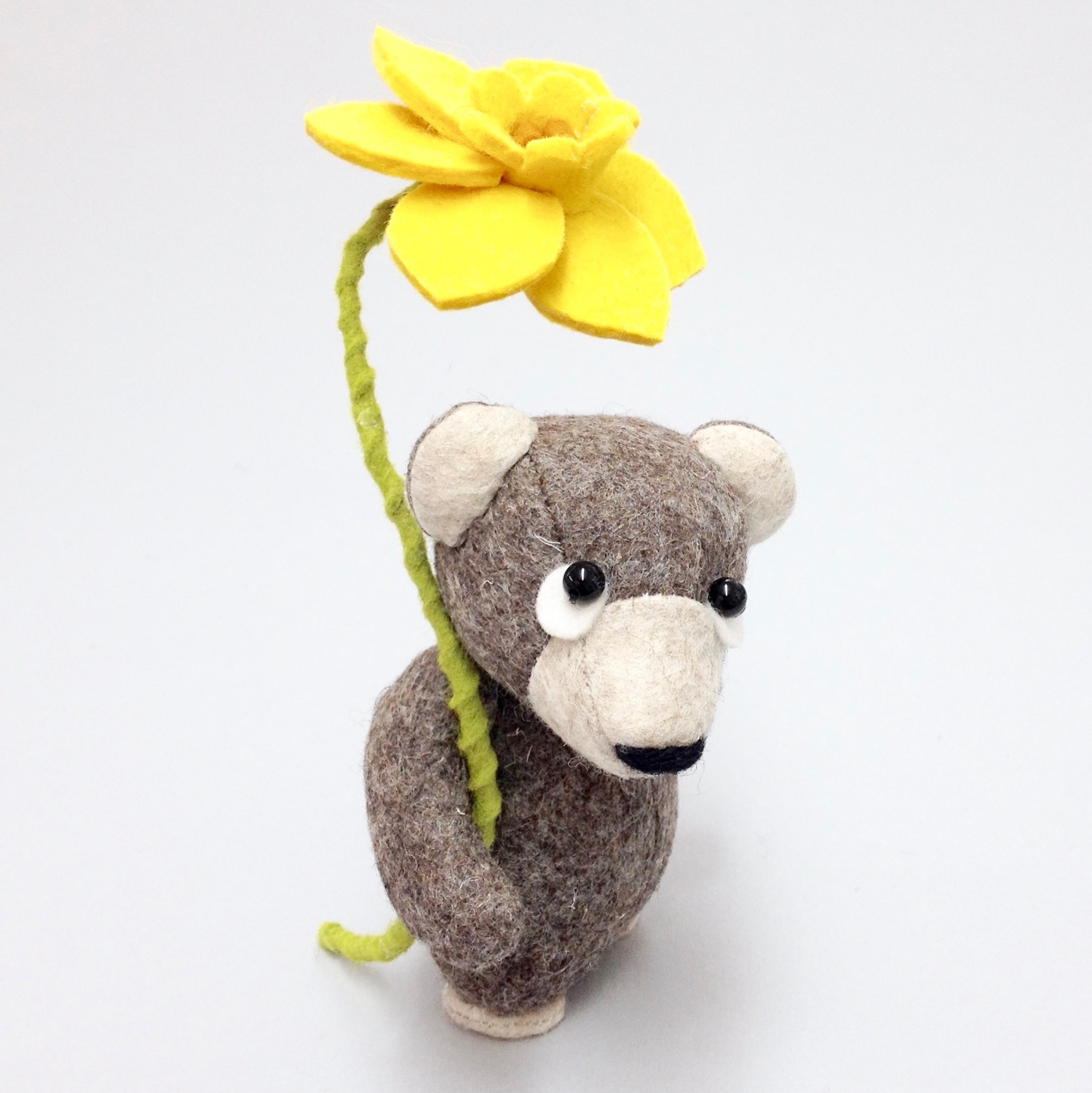 Bilberry Woods storybook character Ernest the Brown Bear as collectible artist doll handmade from 100% wool felt with moving joints and felt daffodil by Laura Mirjami | Mirjami Design .jpg