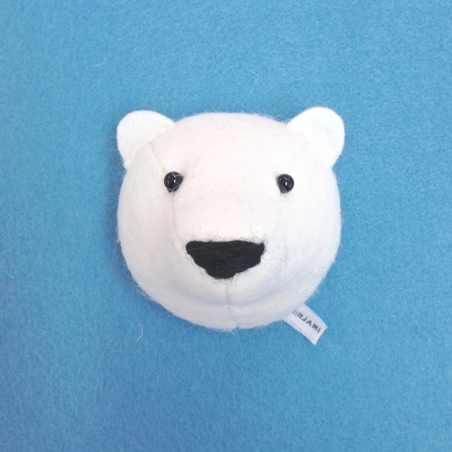 Handmade wool felt polar bear fridge magnet by Laura Mirjami