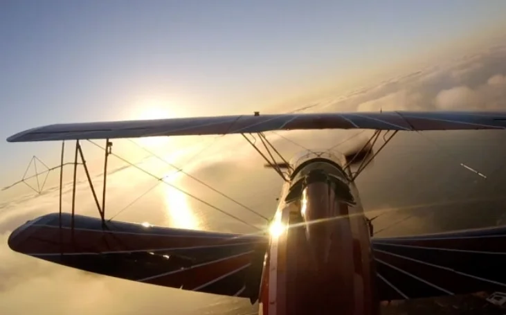 There is something magical about our single person open cockpit biplane --especially around sunset.