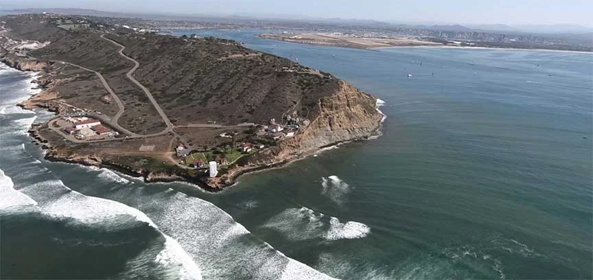 Our biplane tour flies around the tip of point loma. 