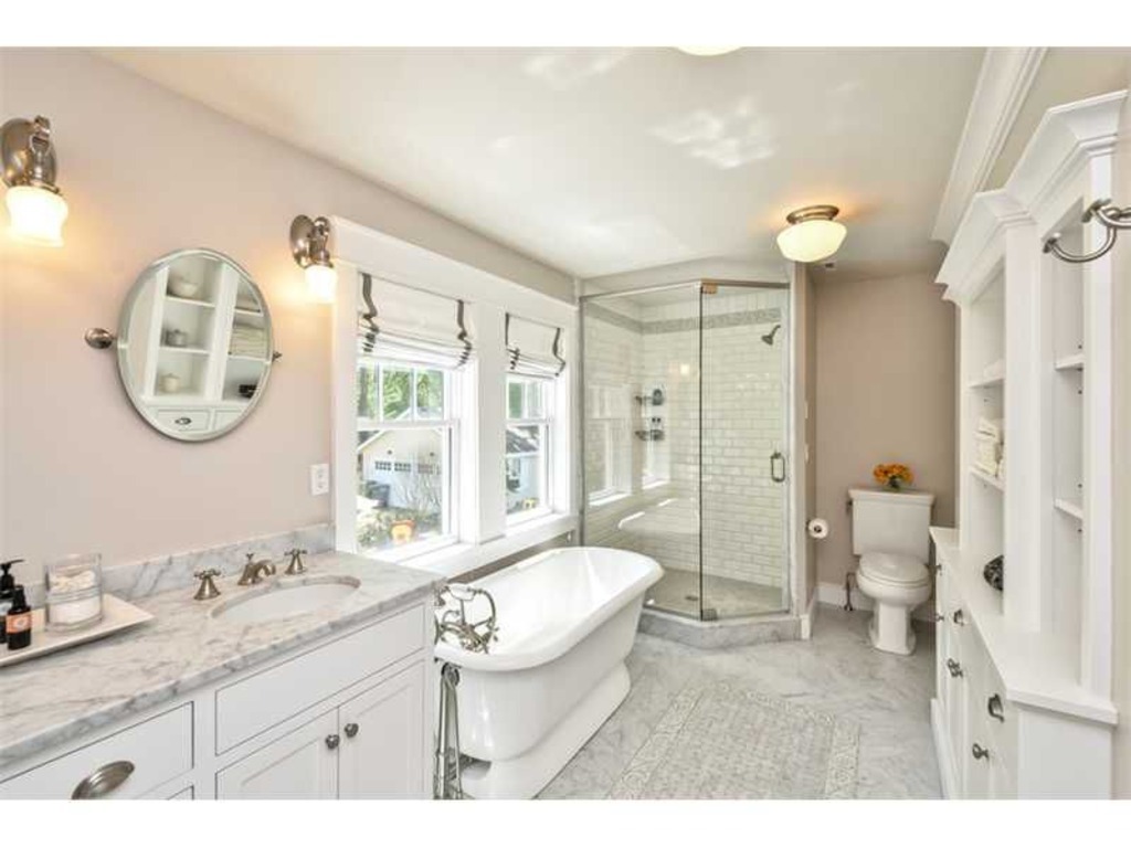 LEED Platinum bathroom marble vanity tub octagonal shower built in cabinets shelves natural light