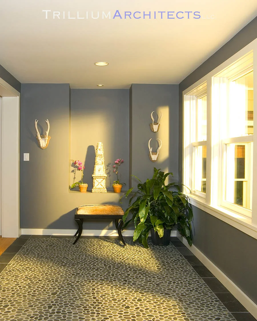Main Entry with natural lighting andriver rock floors