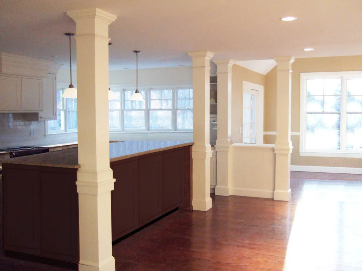 Kitchen renovation with natural light and painted detailed columns