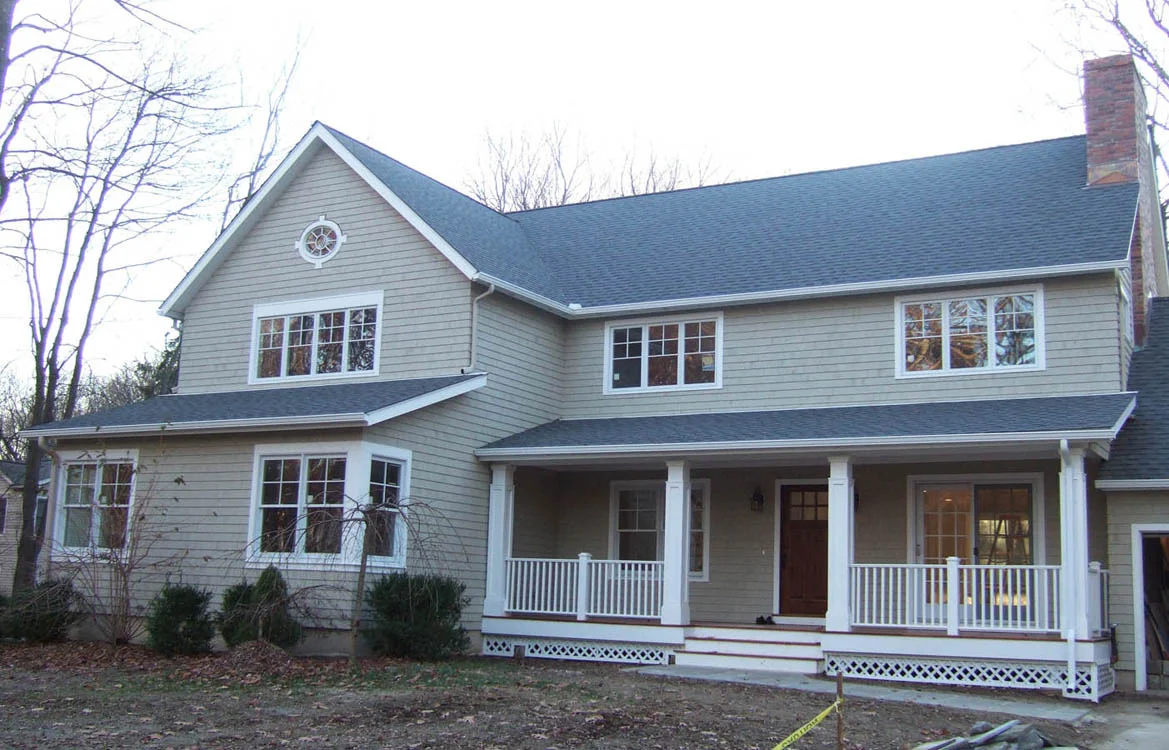 Ranch renovation exterior front with energy efficient windows and porch