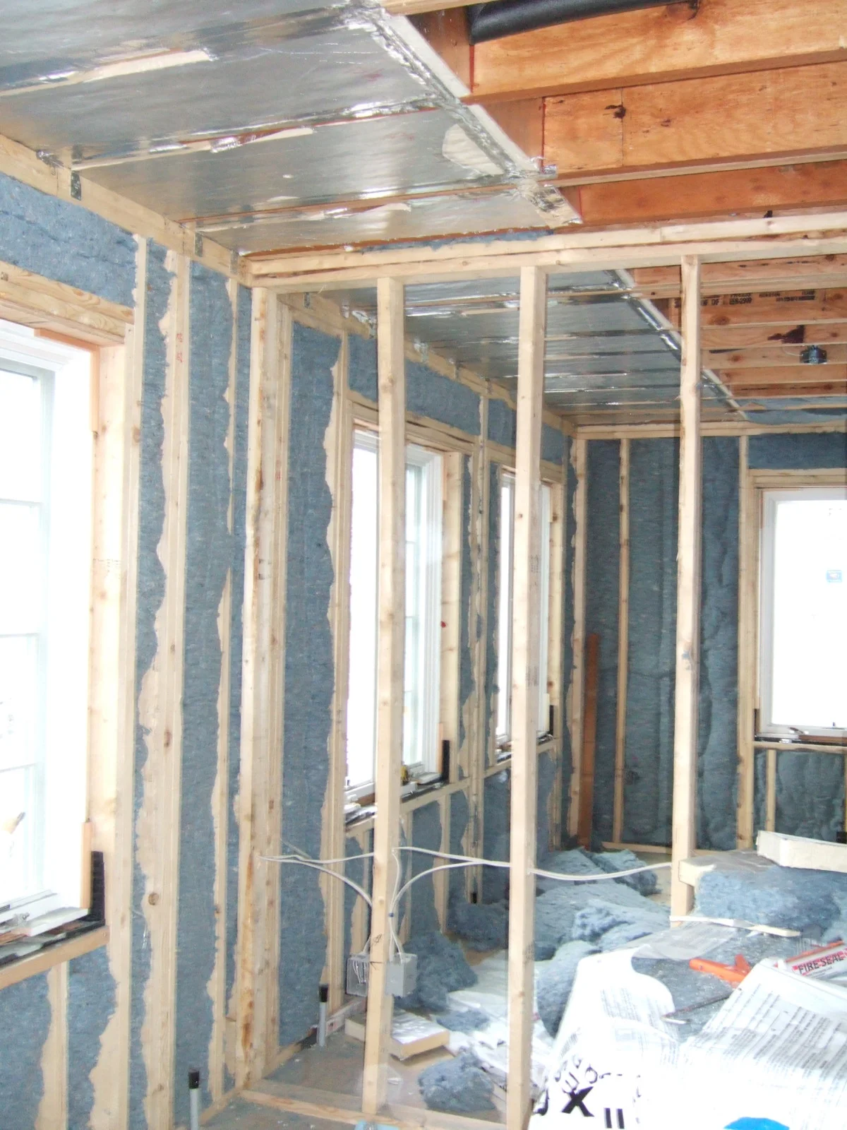 cotton batt insulation being installed soffit detail.jpg