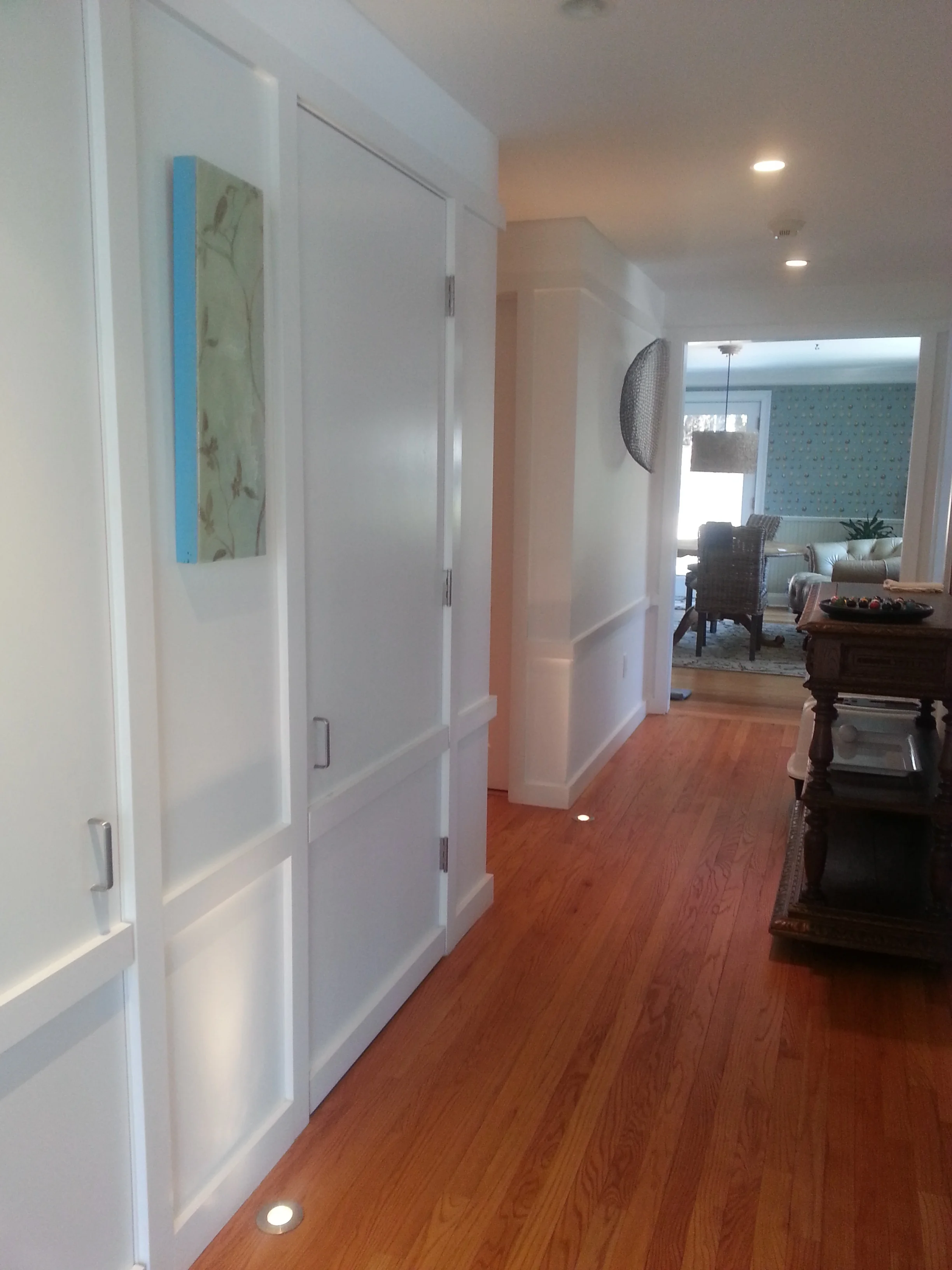 hallway with natural hard wood floors