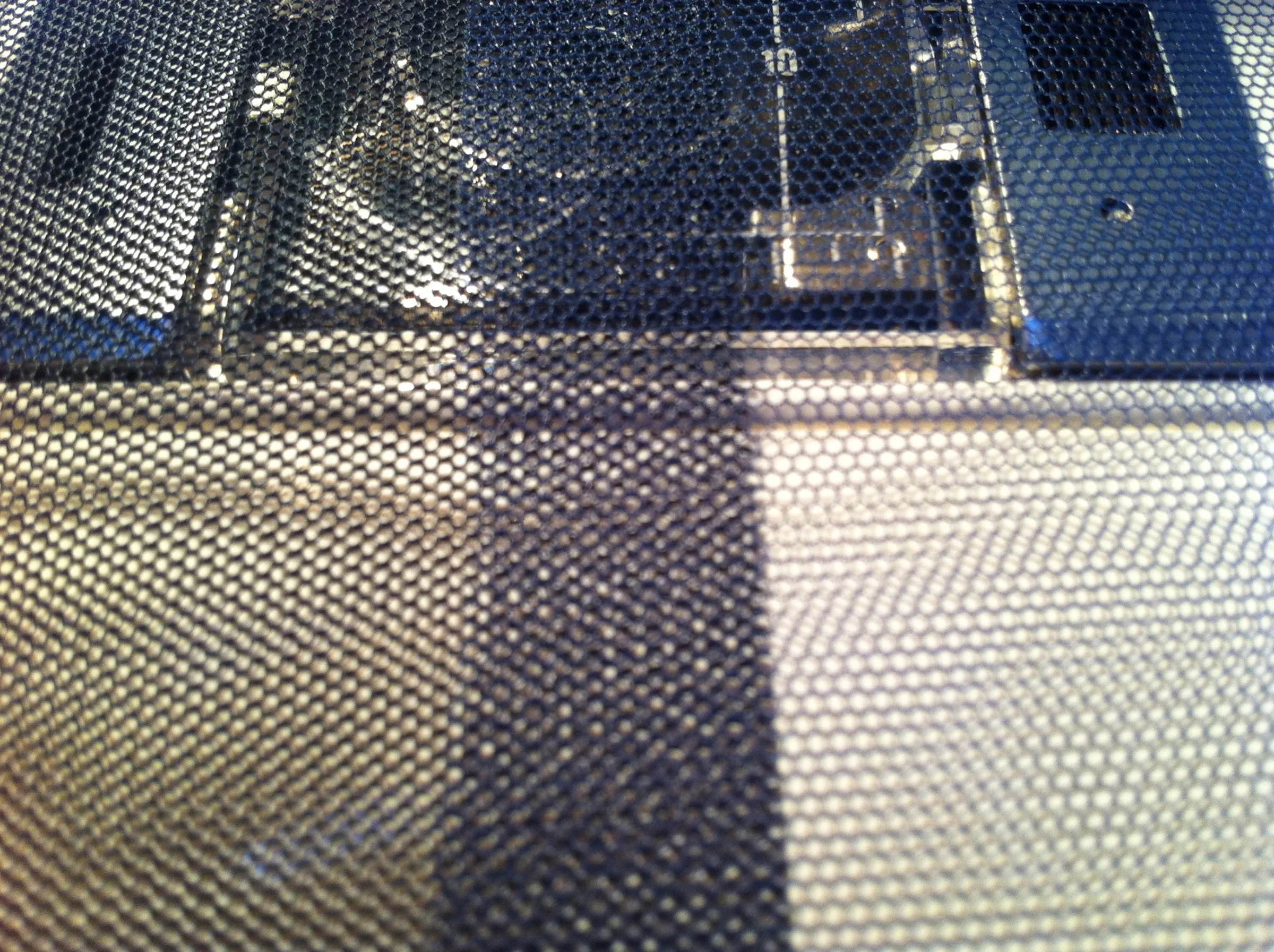Testing the theory that layering mesh could make a noir patterns that could create the effect the haziness within the painting.