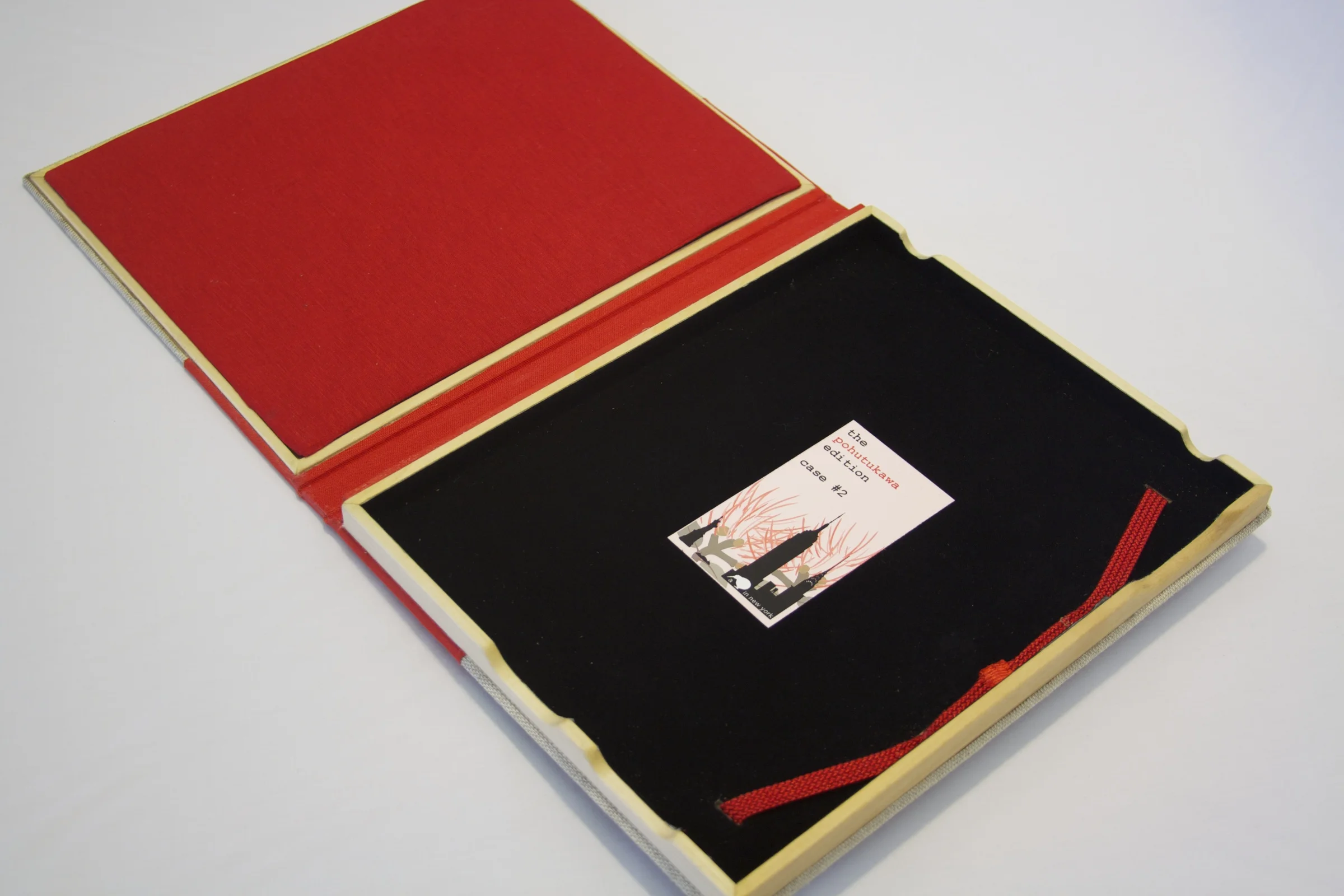 Old Book Case - Pohutukawa Edition - Quarter View - Cover Open