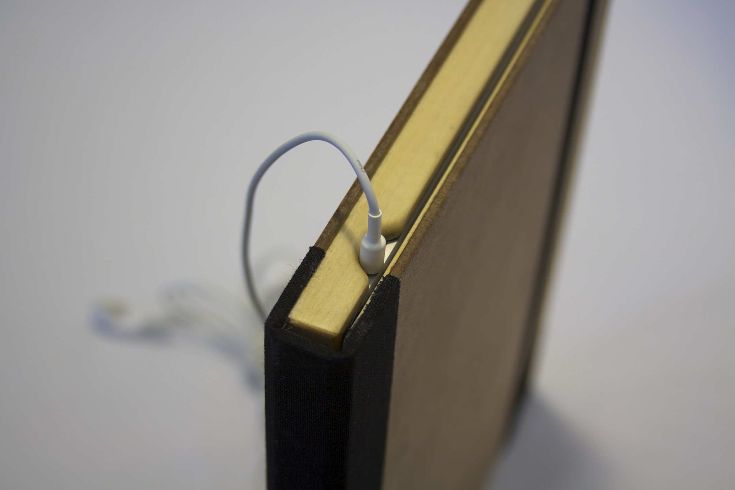   Old Book Case - Headphone Cable in  