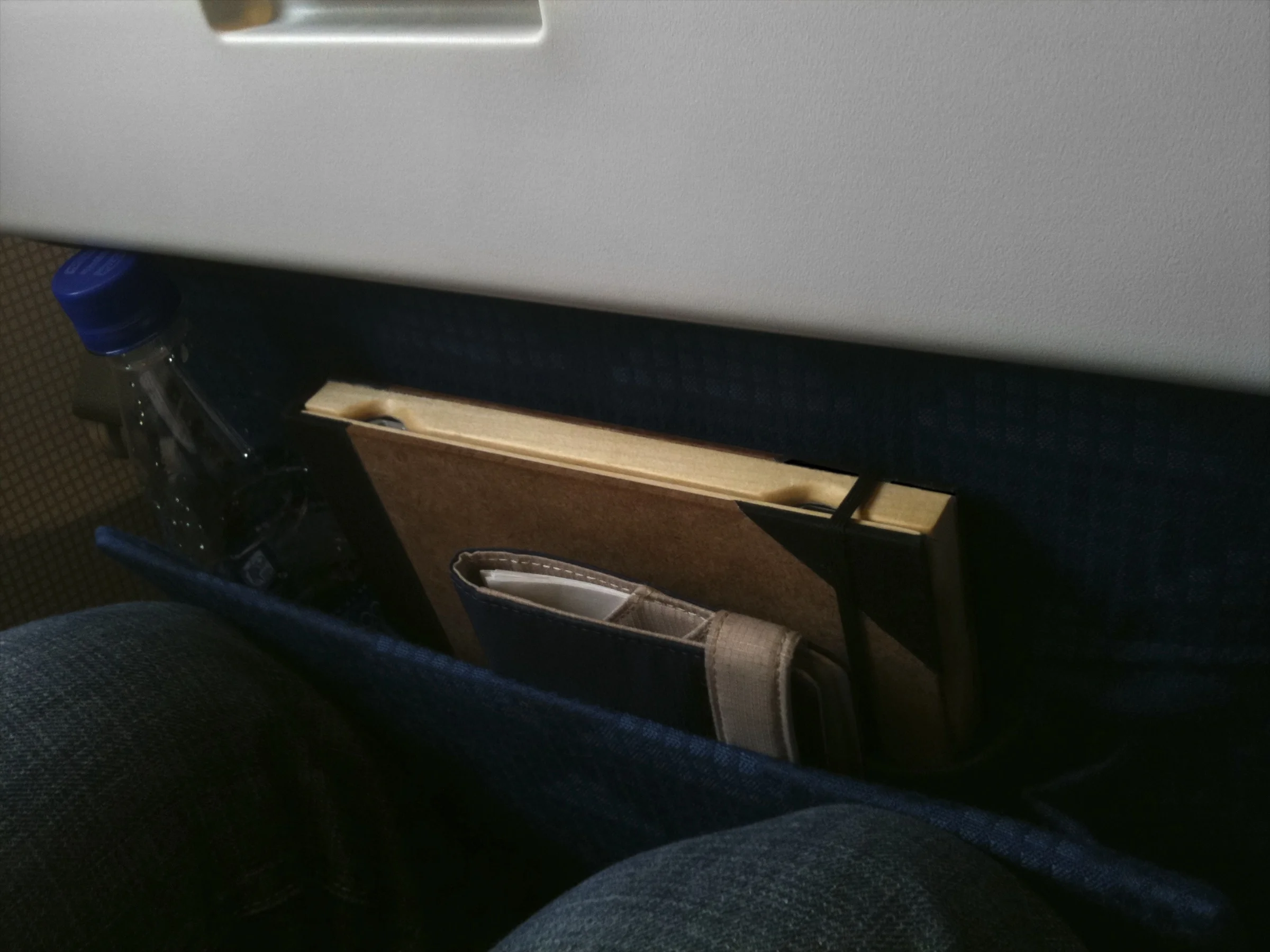 Old Book Case for iPad in a seat pocket of a plane