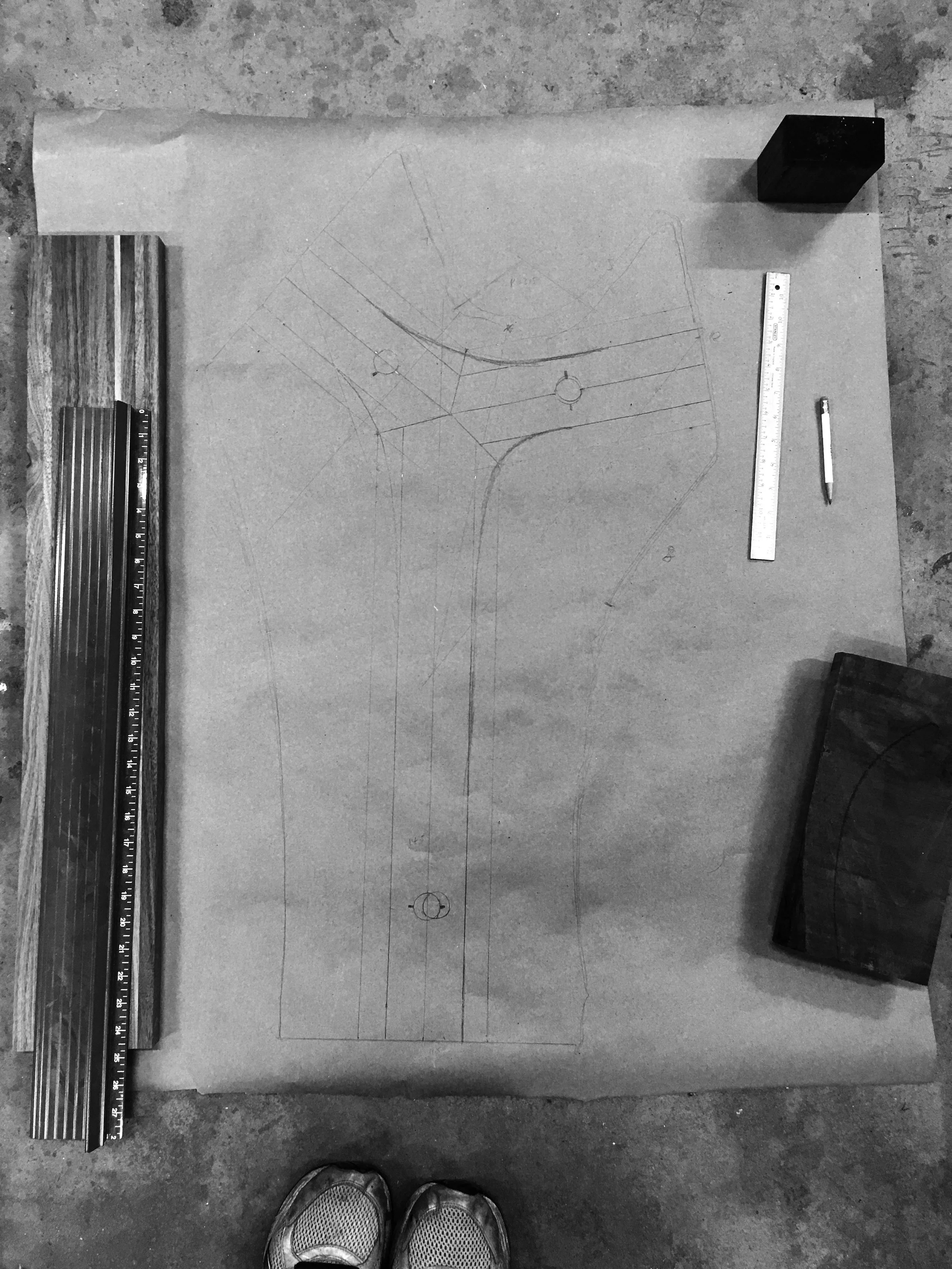 Here's me standing over the 1 to 1 drawing of the Y Side Table, making sure the feet is sympathetic to the table top, as well as finalizing the location of the V legs.