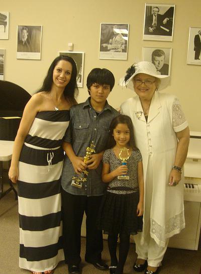 Marilyn and her two daughters, Lauren and Lily, after a July 2012 piano recital with their teacher, Eileen Mattioli, of St. Petersburg, Florida. Mrs. Mattioli was Marilyn's first teacher at the age of 5.