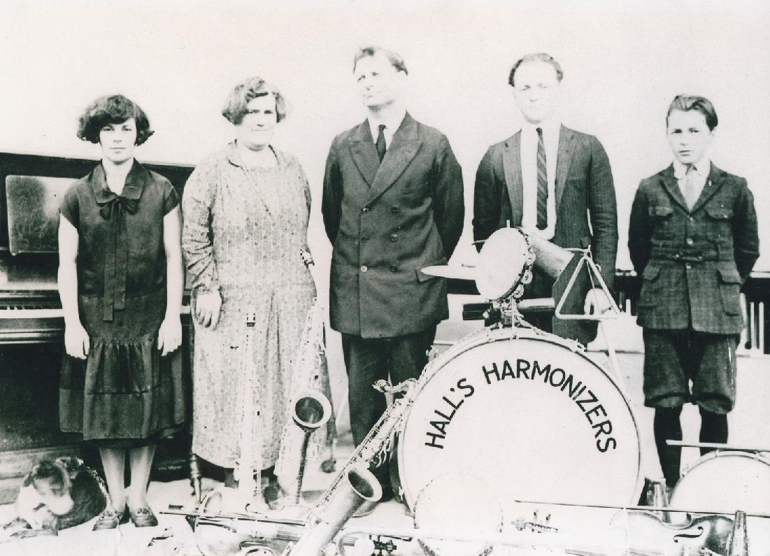"Hall's Harmonizers" ca. 1925. Cory's great grandparents with their three children posing for their family band portrait. From left to right: Audrey, Lillian (mother), Andrew (father), Lewis, Kenny