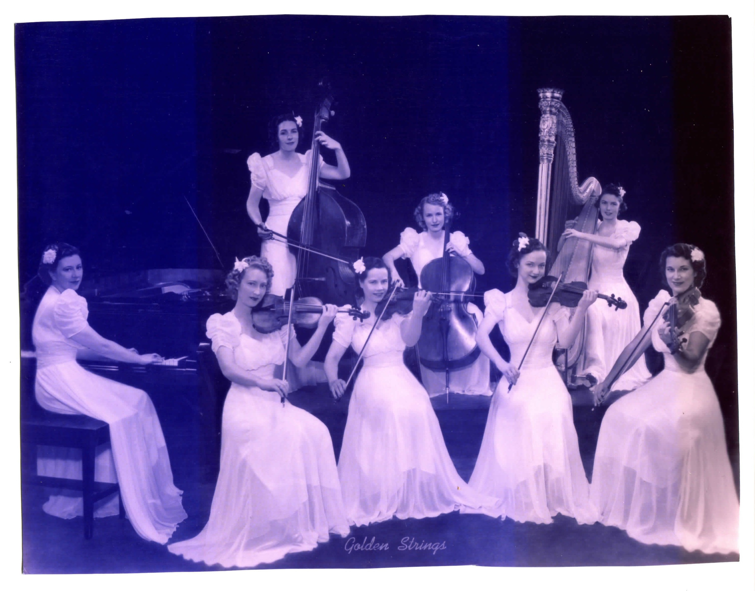 Cory's great aunt, Audrey, in a professional photo from ca. 1936 (front, middle). A professional violinist who also played other instruments, Audrey was the lead violinist in this all-women strings group.