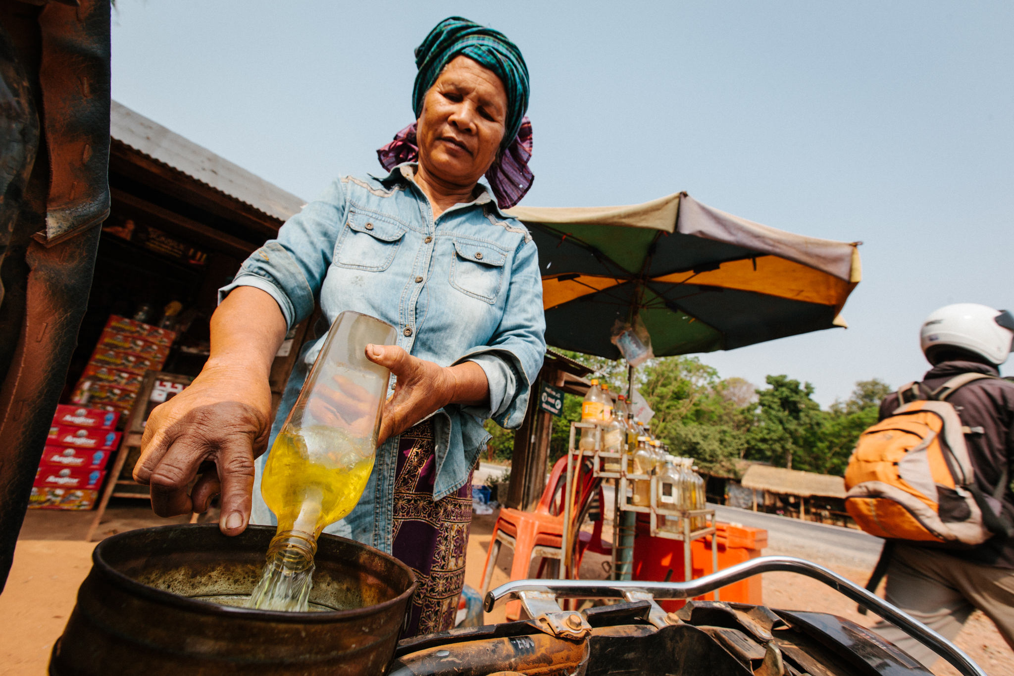 In rural Cambodia, you'll be hard-pressed to find fuel pumps. Instead, gasoline is dispensed from a Johnny Walker Red Label bottle.