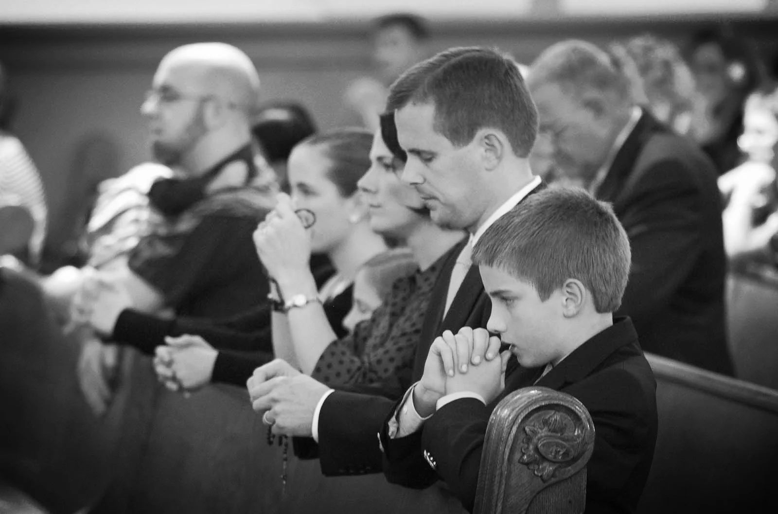 Our family praying the Rosary before Mass.