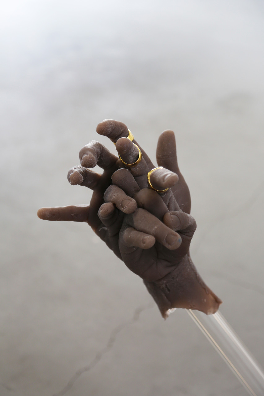   that hand gon’ stutter,  2019  silicone, glass, Patek water, gold alloy 