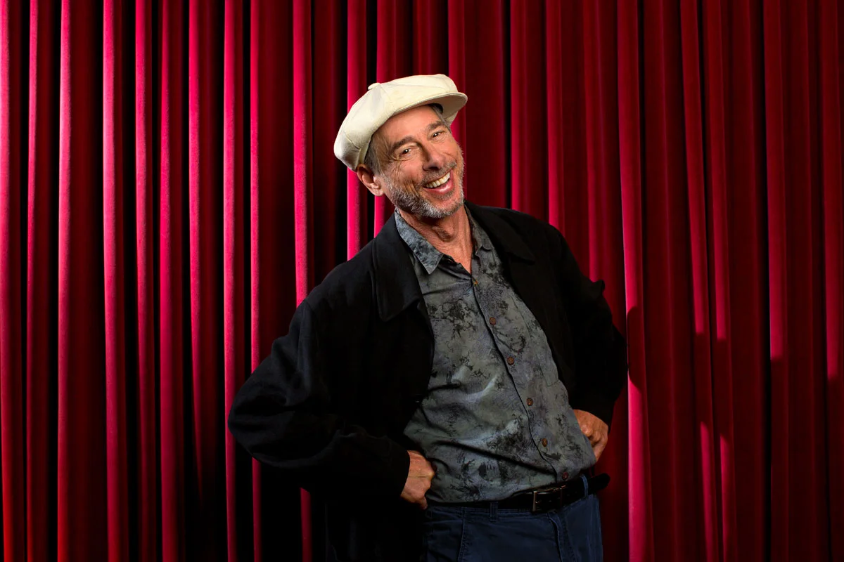 Stuart-with-Red-Curtain.jpg