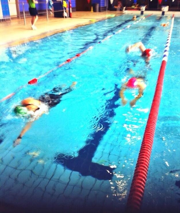 Emily whooshing along in her green hat! 