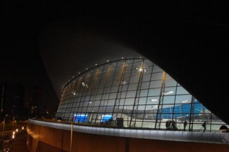 The aquatic centre glowing in the dark.