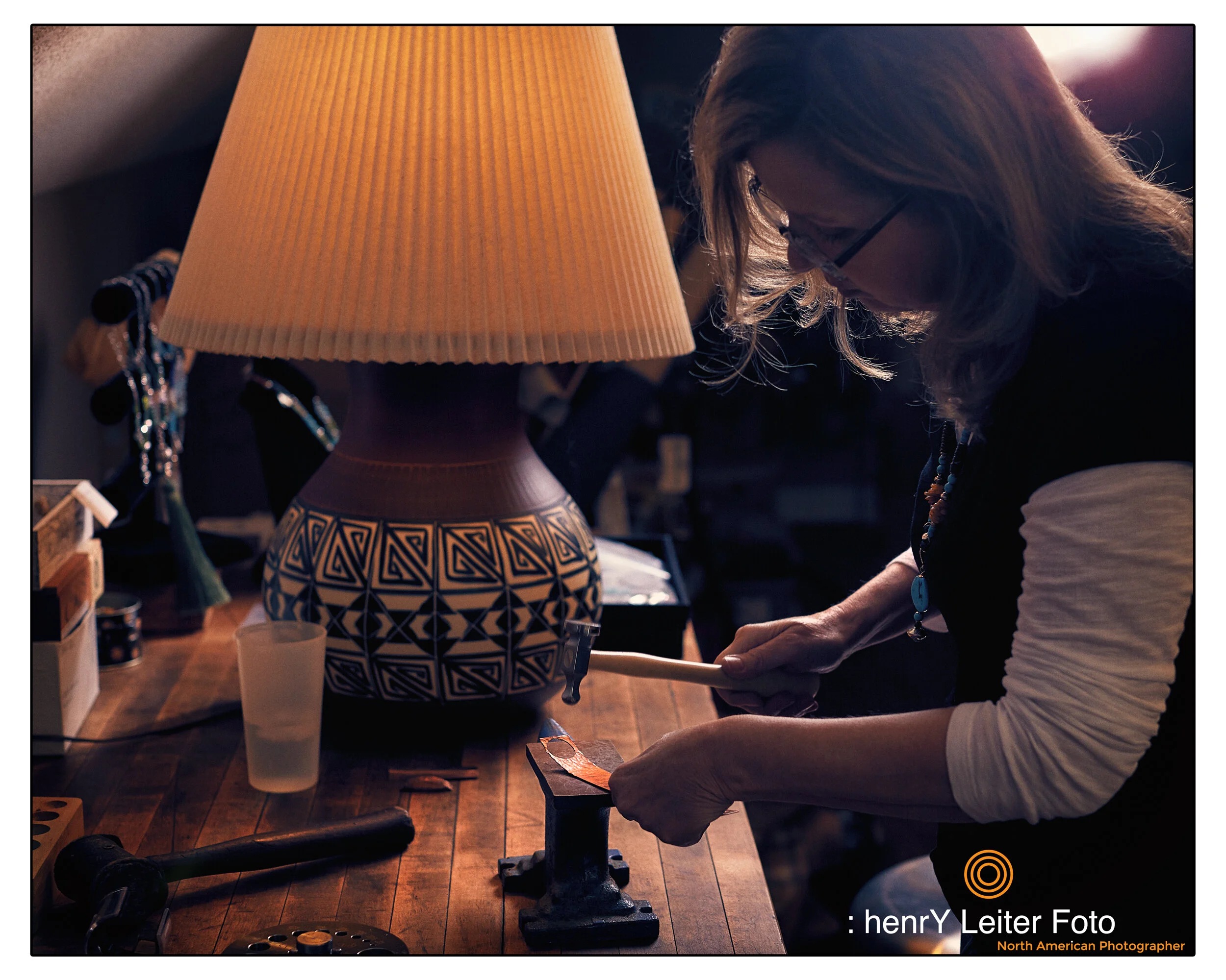 Portrait of the jewelry artisan Cyndee Bartch in her Granville, Ohio studio, by photographer henrY Leiter.