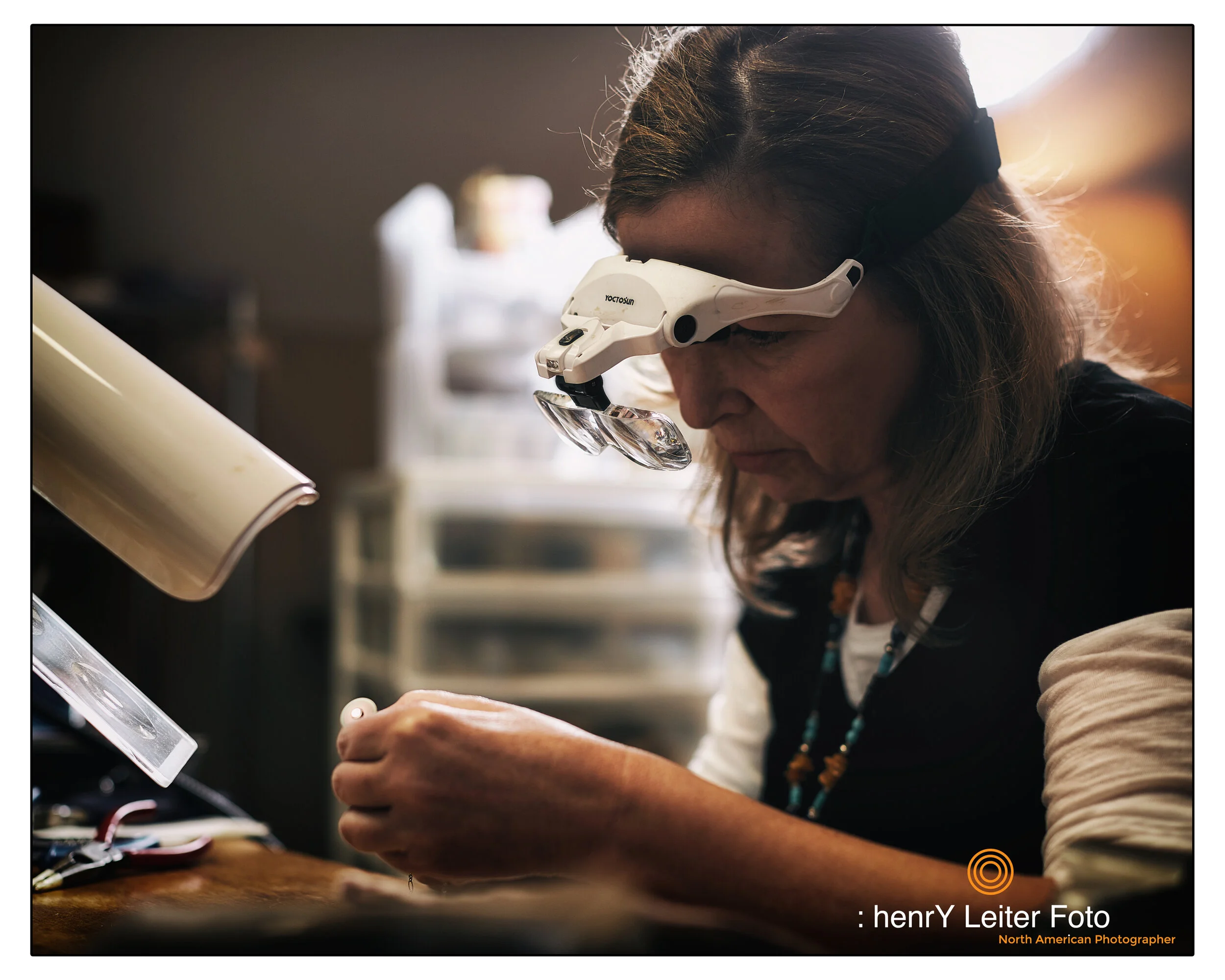 Portrait of the jewelry artisan Cyndee Bartch in her Granville, Ohio studio, by photographer henrY Leiter.