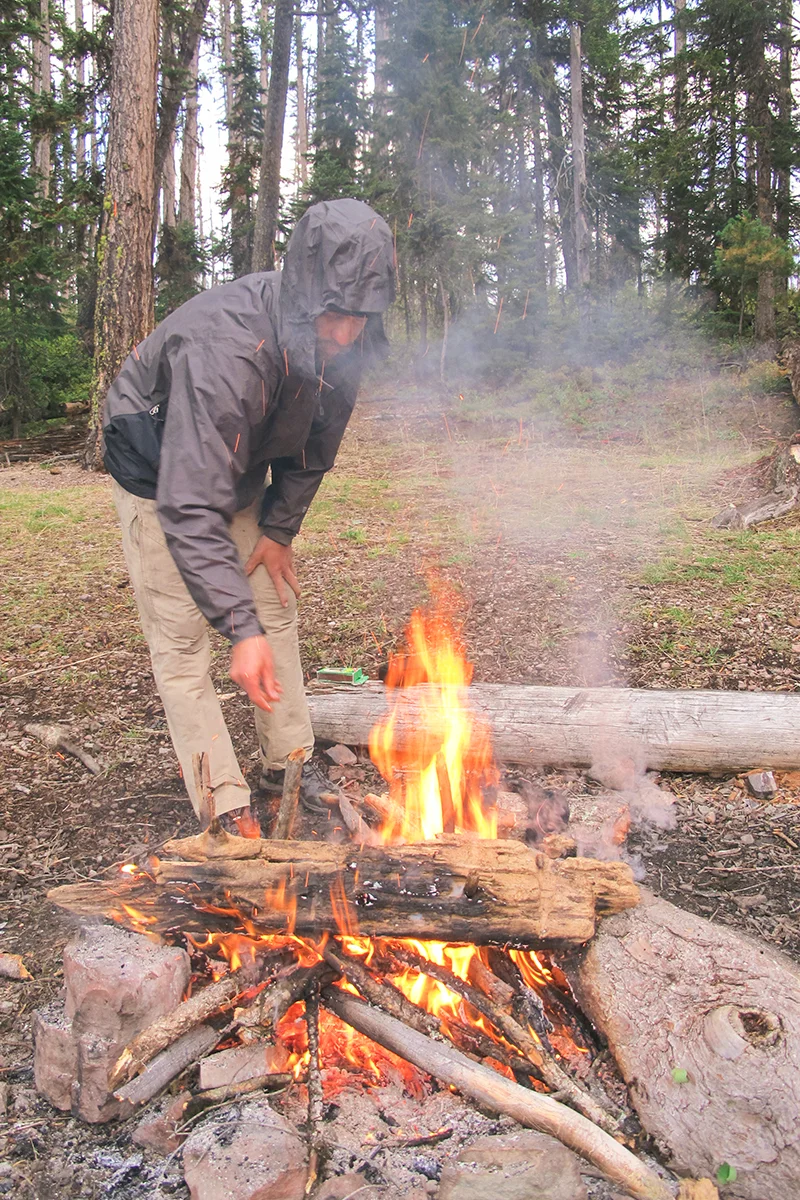 We rose in the morning to find all the peaks around us had been dusted with snow overnight. While Adam built a fire to heat up some water for oatmeal, I headed down to the lake to take another whack at catching a fish. 