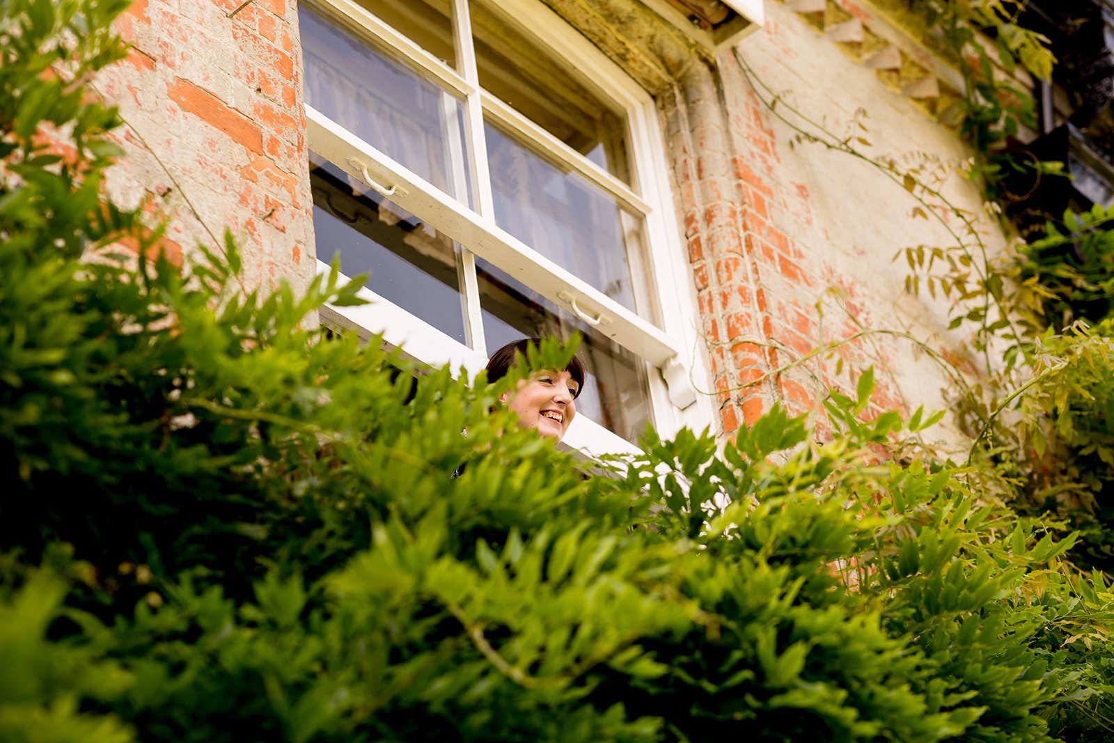 Photographer at upstairs window