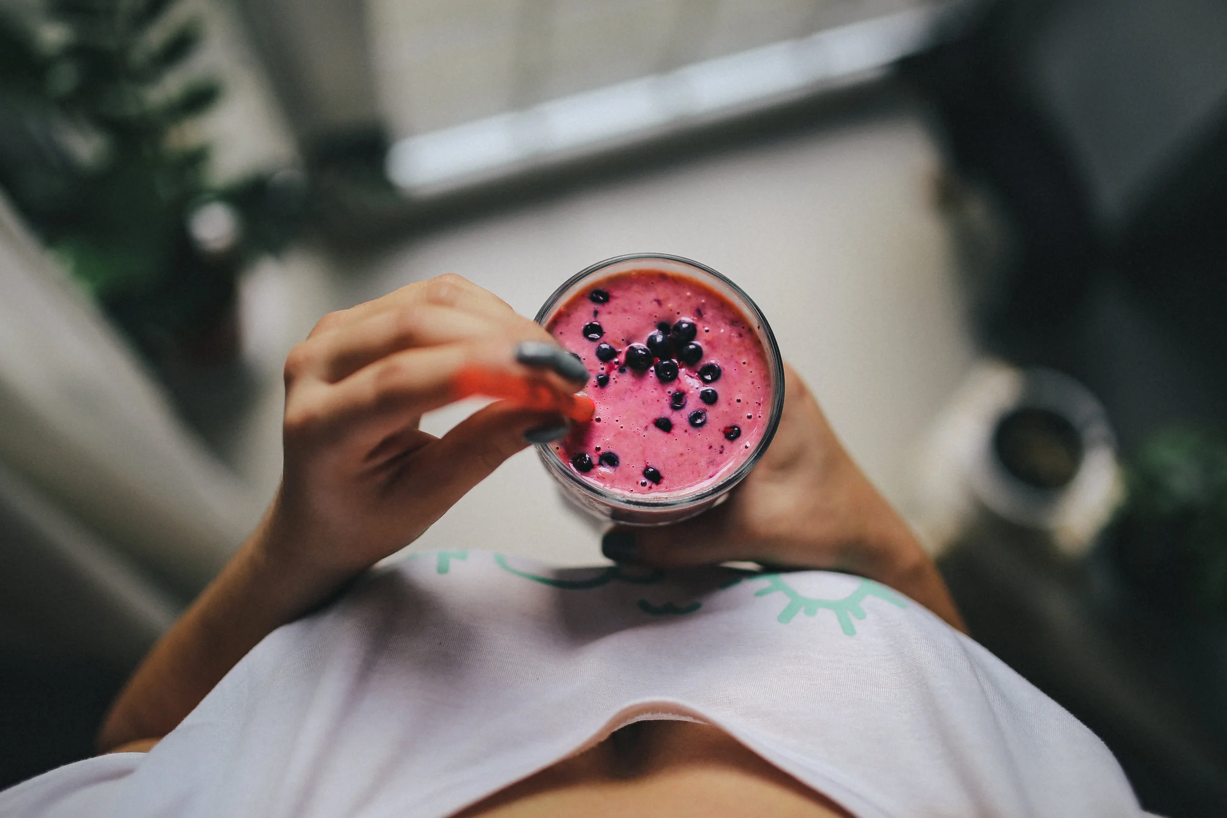kaboompics_Girl holding blueberry yoghurt.jpg