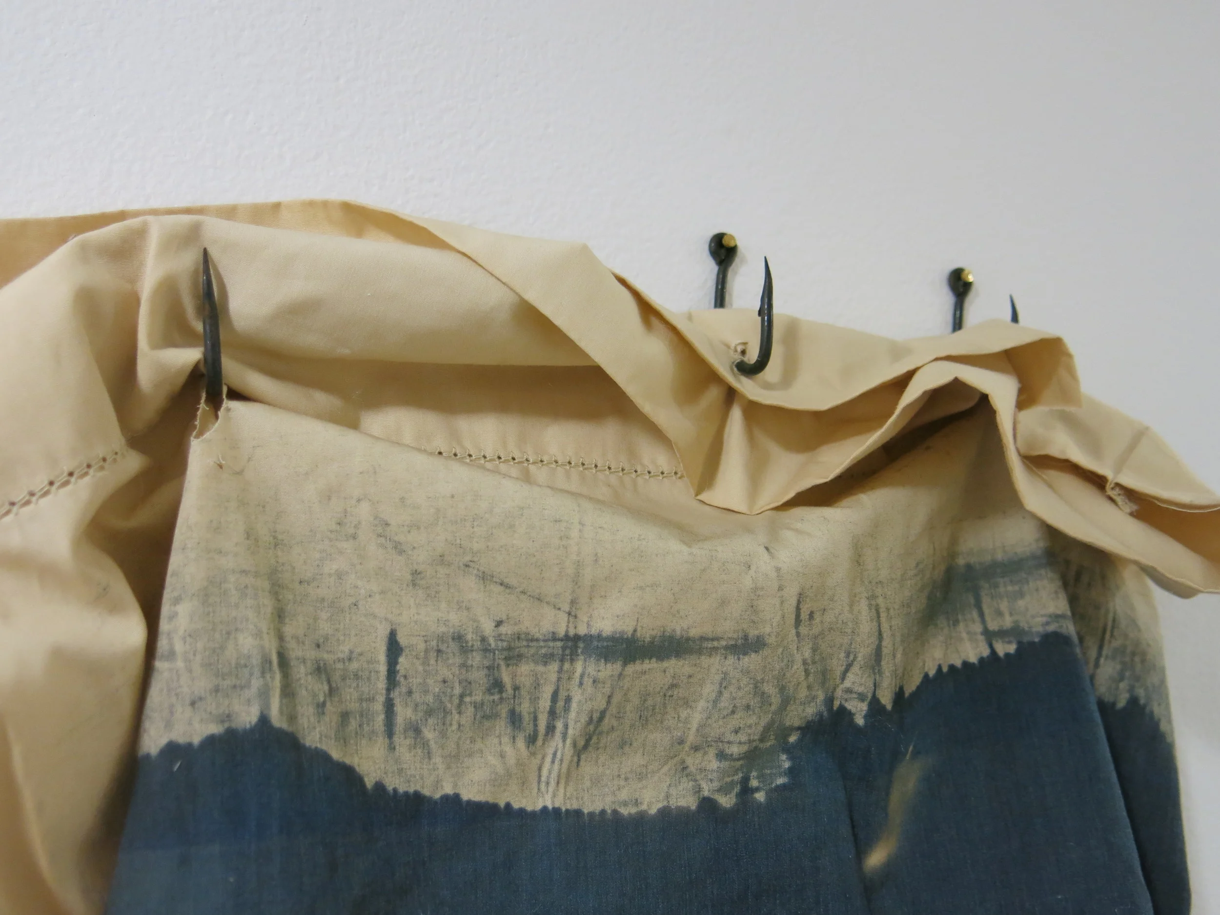   X-Ray's In Bed    Toned Cyanotypes of the Artist's X-Ray's on Cotton Pillowcases, Filled with stuffing and rocks, Sewn with the Artist's Hair, Hung with Hooks,&nbsp;  