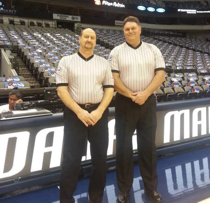 Bart Millsap (left) refereeing with colleague at the American Airlines Center in Dallas, TX.