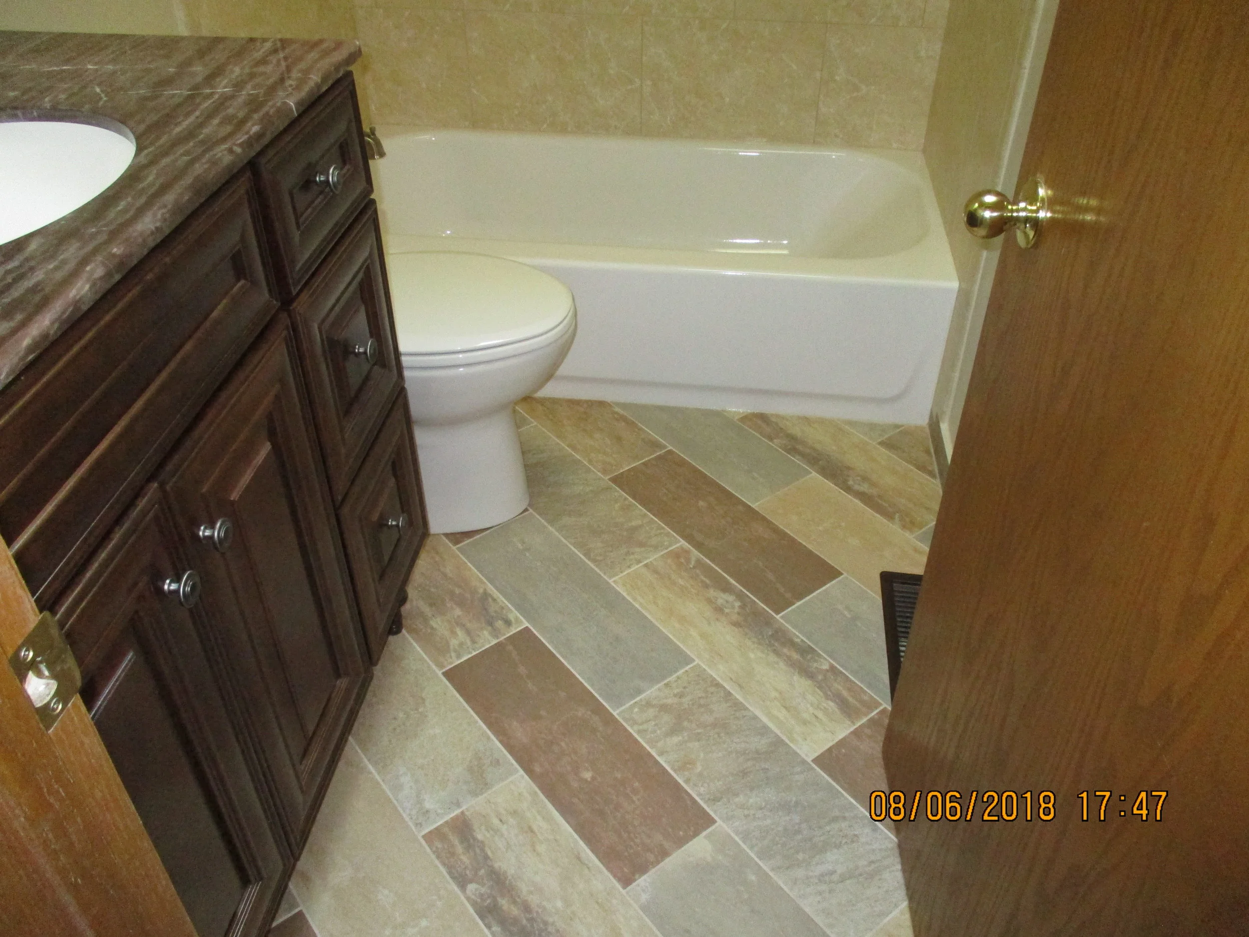 New tub, vanity, toilet, floor tile and tub wall tile