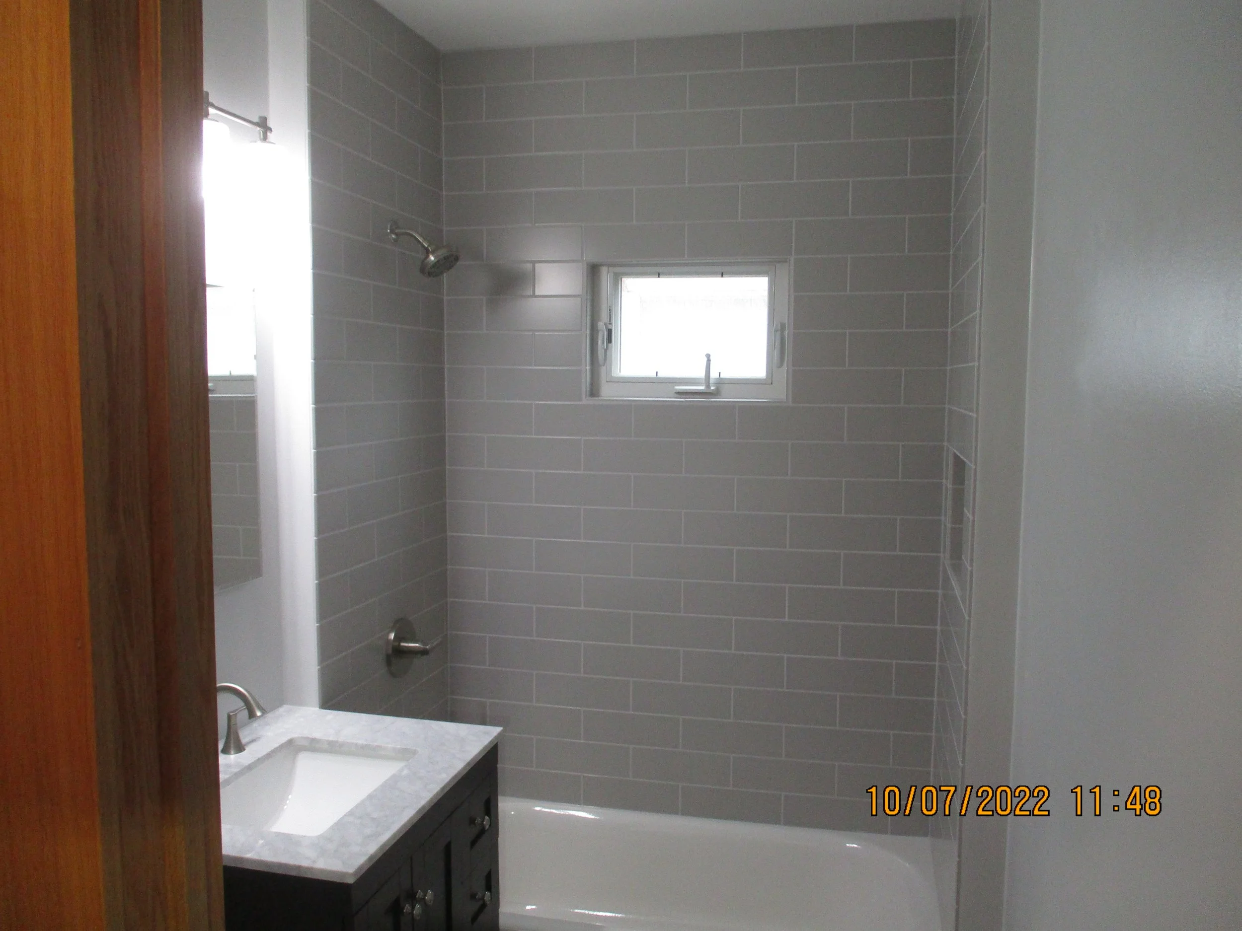 New tub, wall tile and vanity
