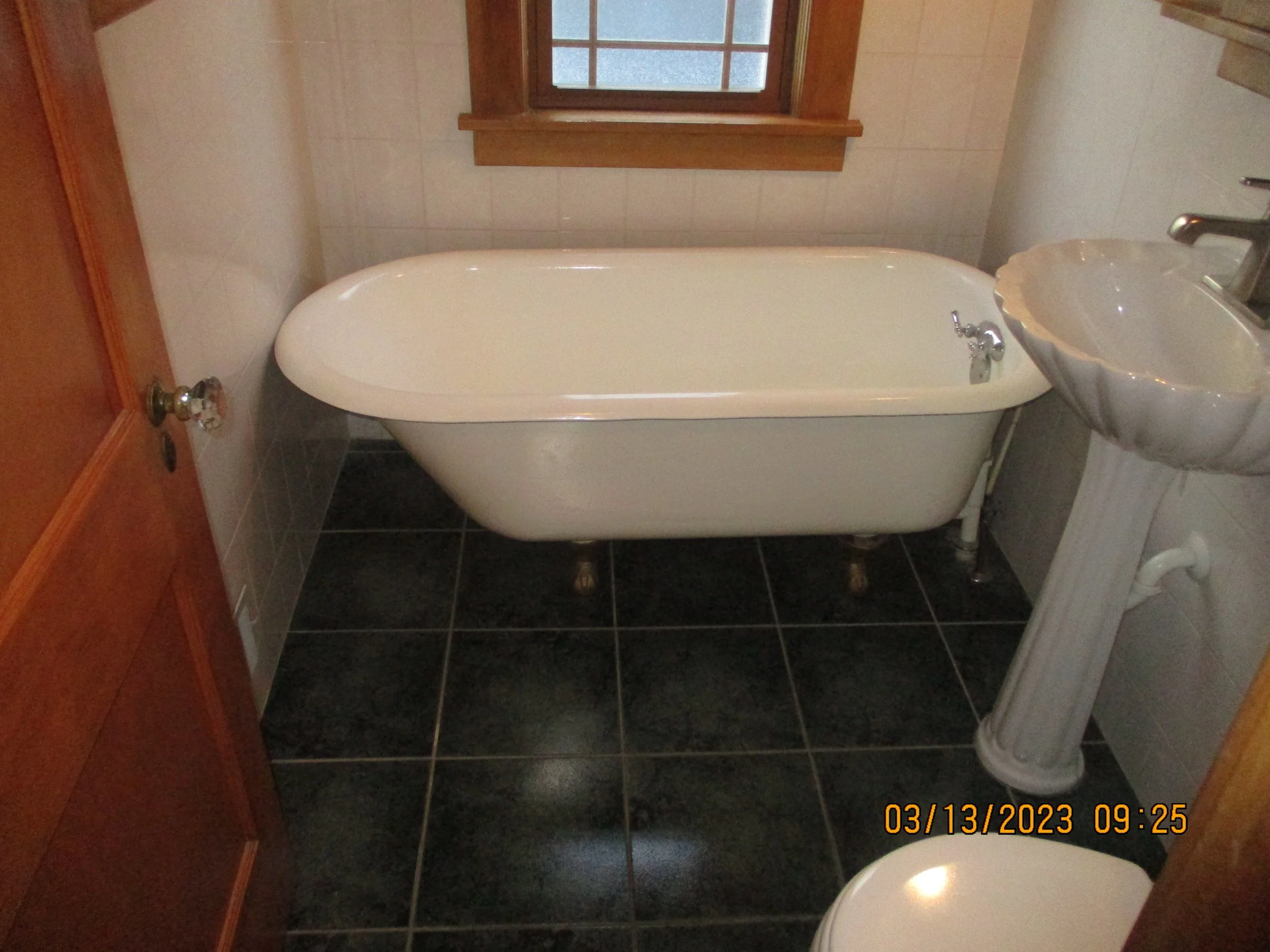 BEFORE: Dated 1950's style, claw foot tub