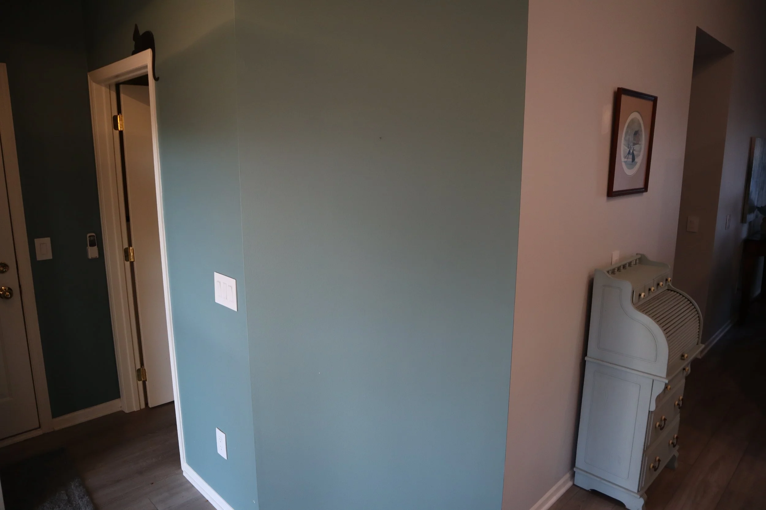 Before: Flat foyer entrance wall