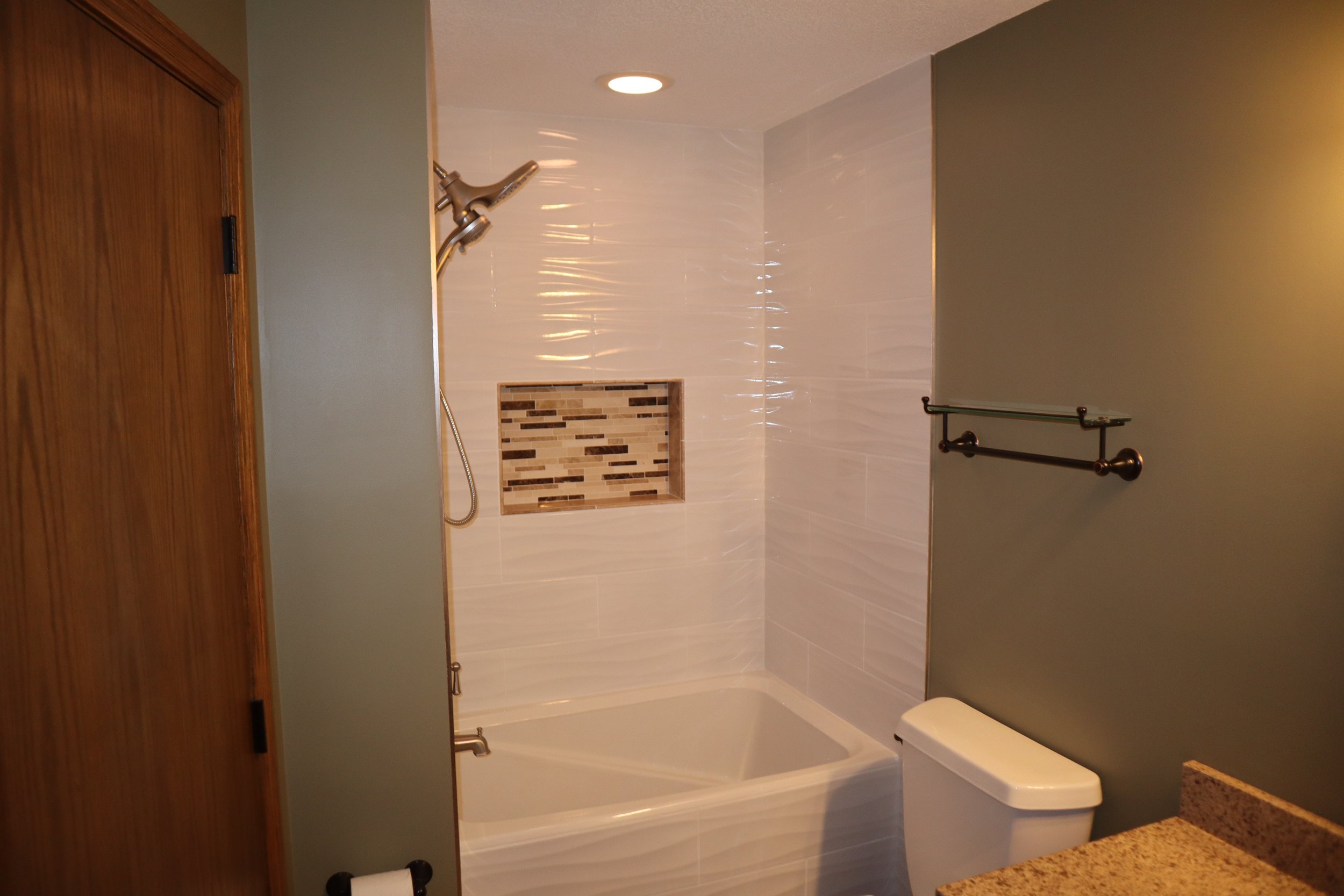 After- Recessed Custom Soap Caddy with Wave tile on the Tub Skirt