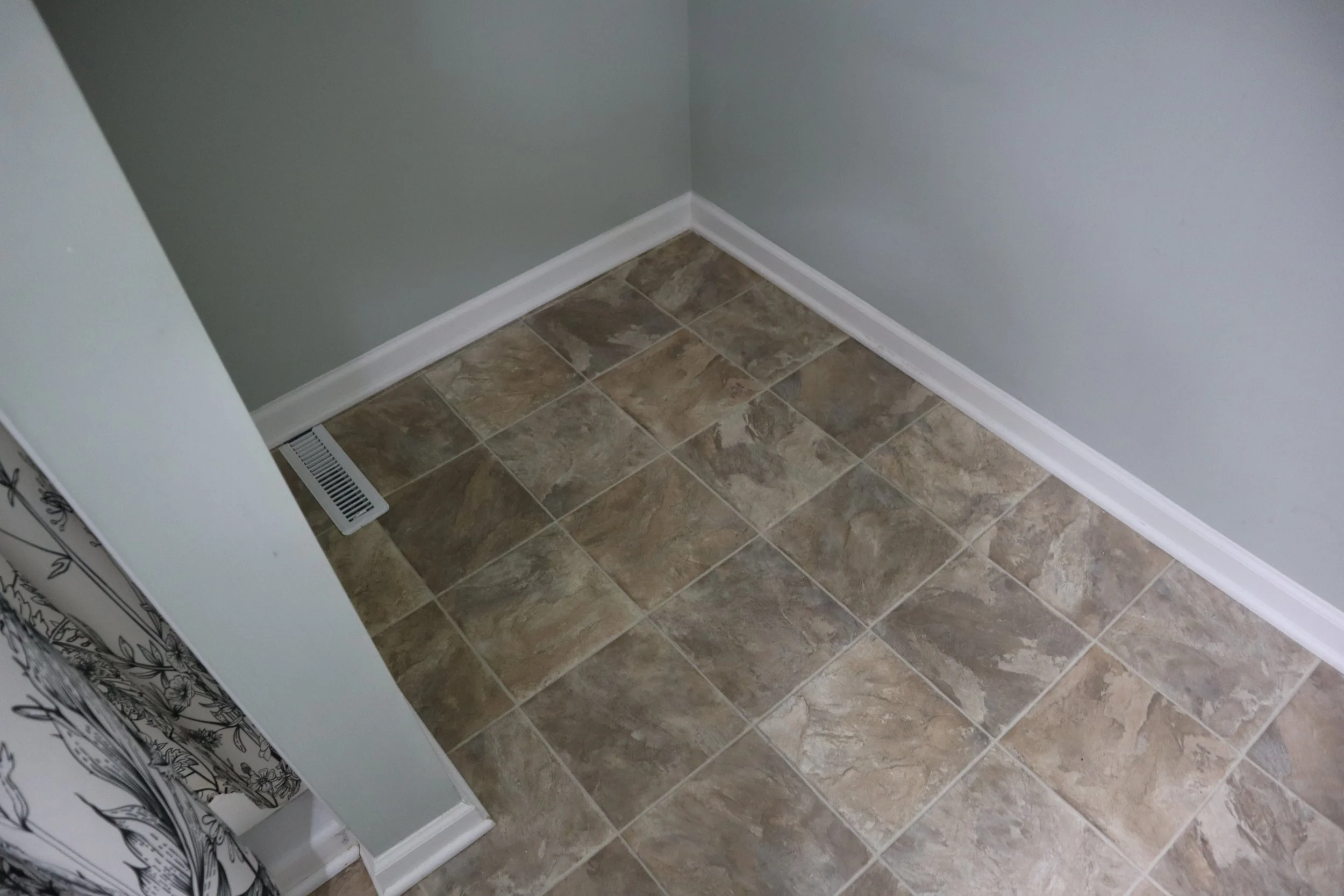 Before- wood baseboard and quarter round trim