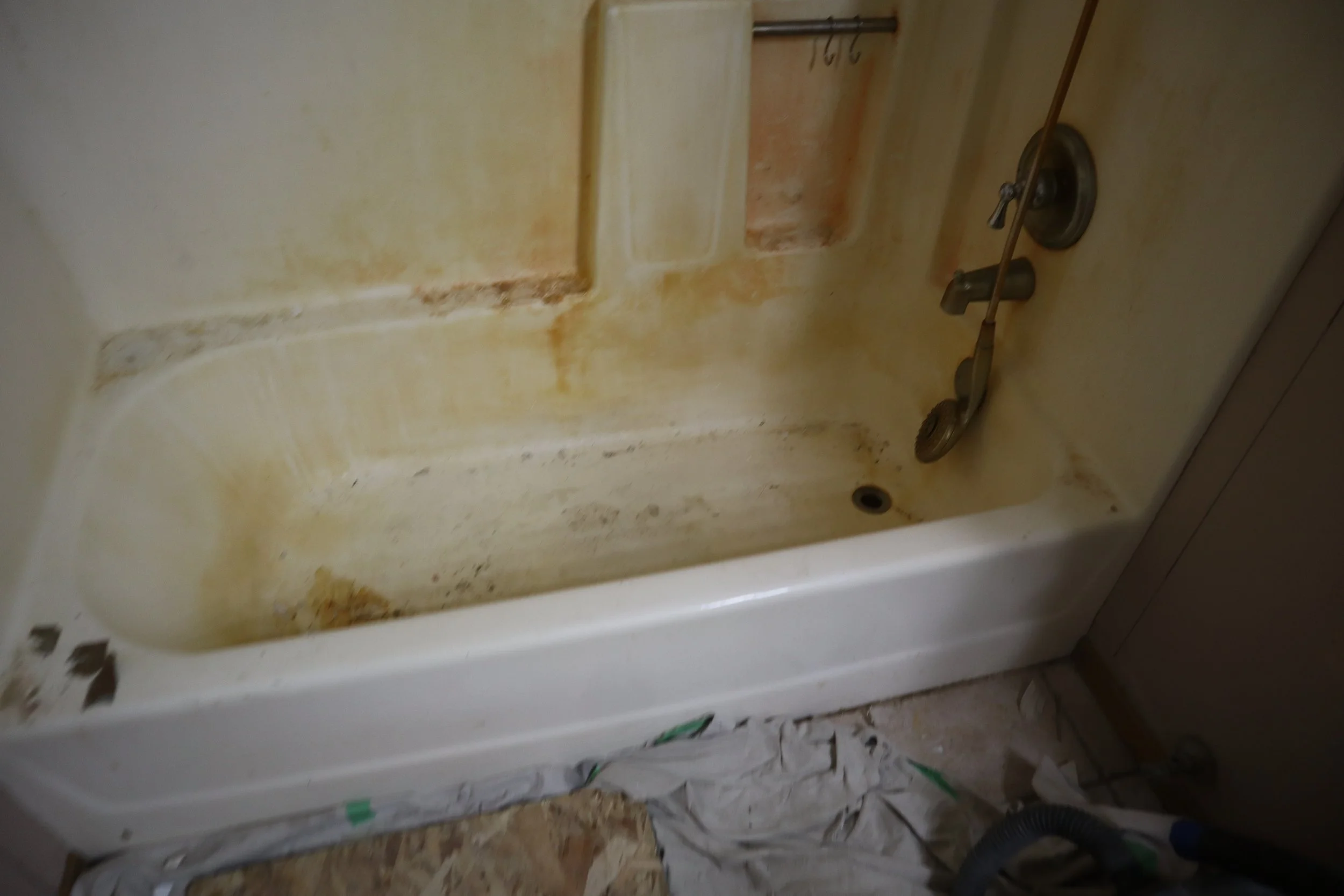 Before: One piece fiberglass tub and walls from 1983