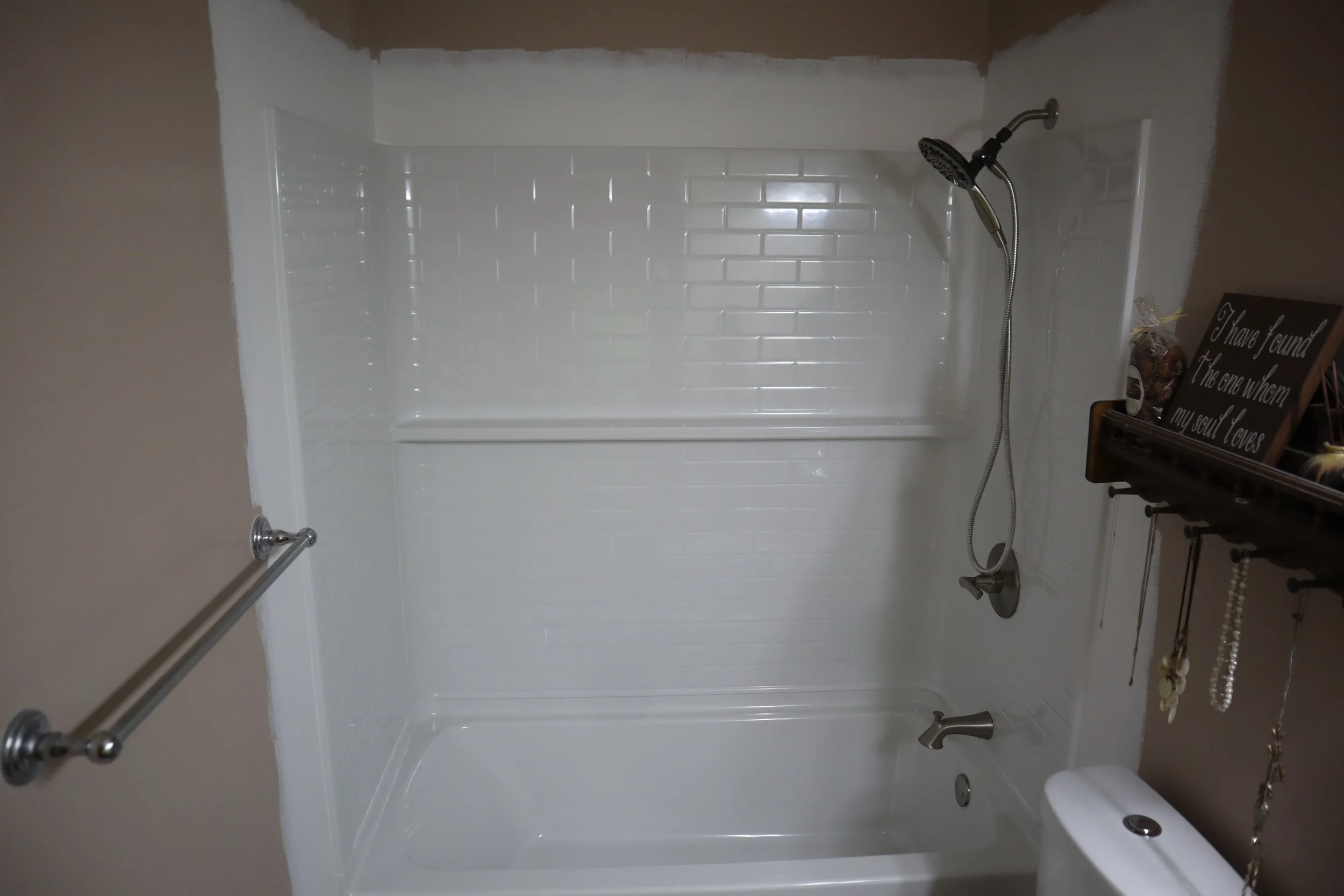 After: 2025 4-piece fiberglass tile walls and soaking tub