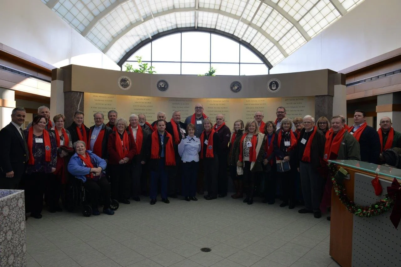 Our group in front of the wall of fallen heros, entryway at the Charles C. Carson Center for Mortuary Affairs