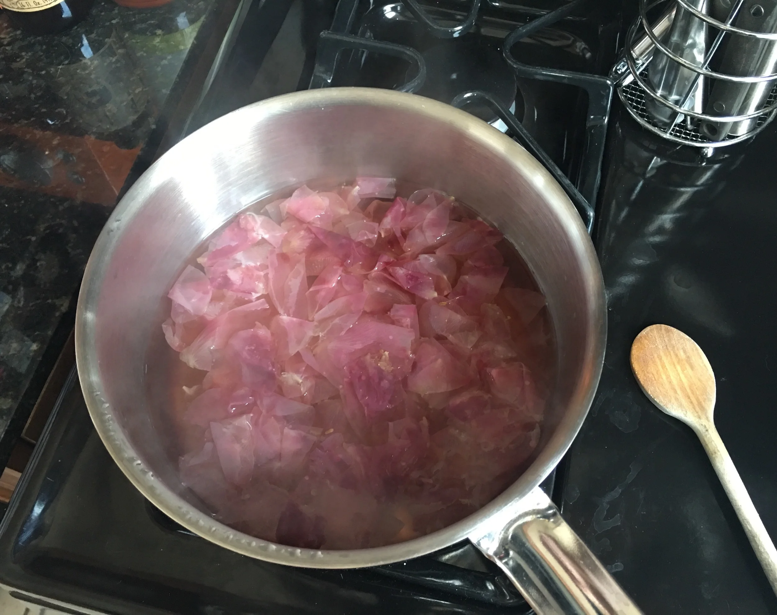 Simmer over low heat until the petals have lost their color and the water is now rosey.