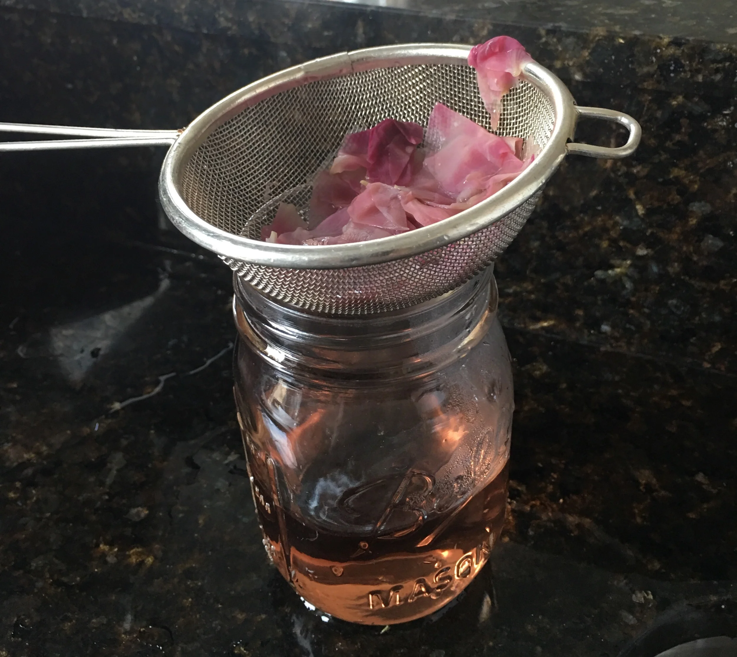 Strain the water into a mason jar or another glass container.