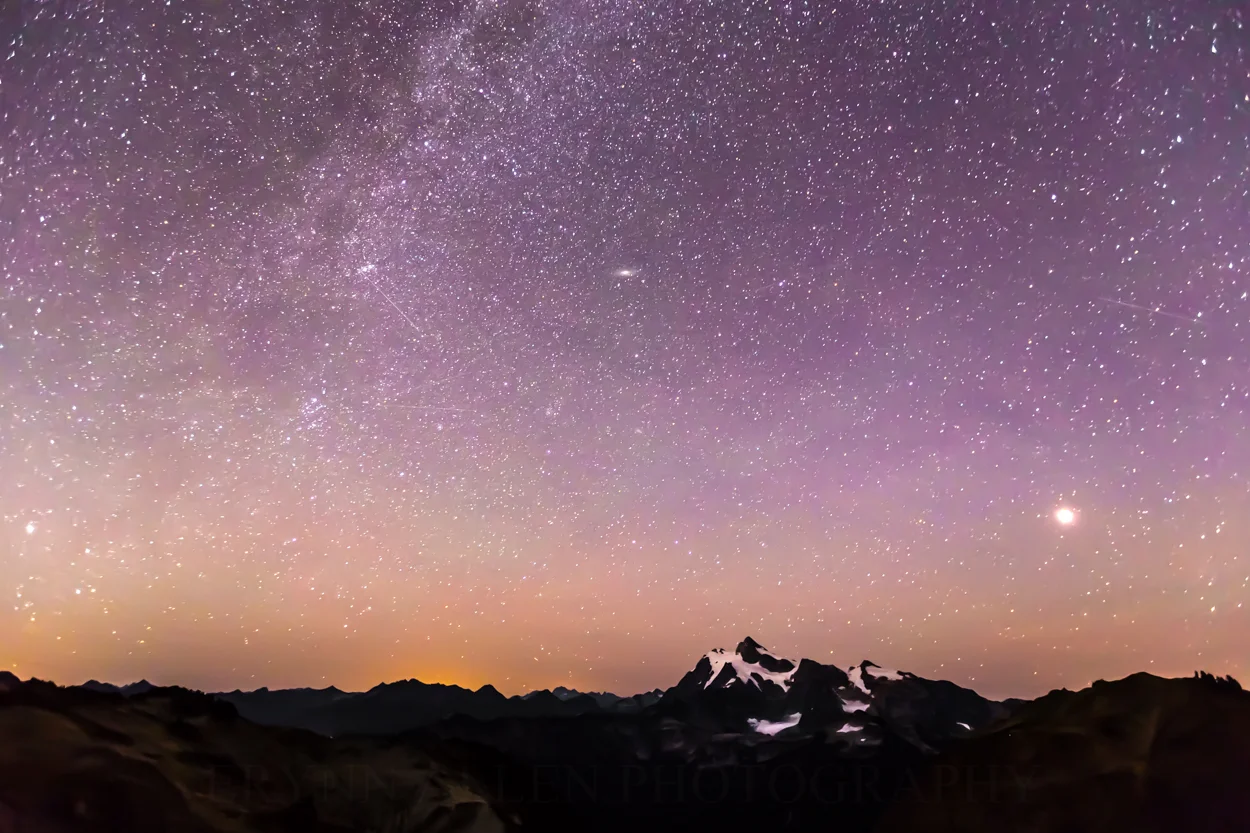 The Milky Way, Andromeda, and the moon, from left to right, hovering above Mount Shuksan and the North Cascades.