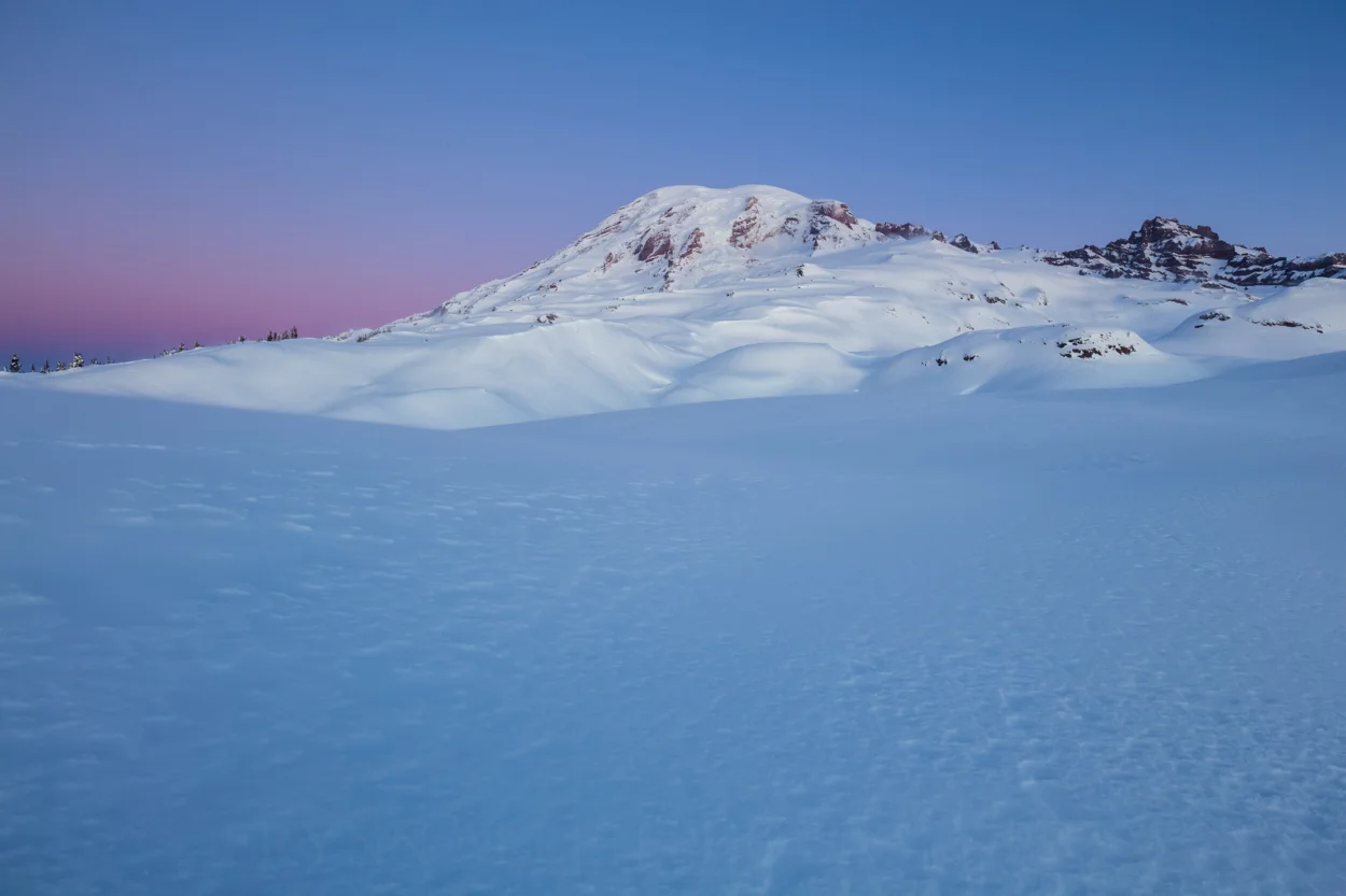 The mountain standing silently before the morning light began to kiss its summit,