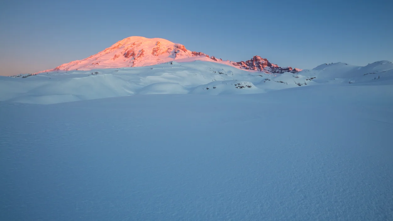 Rainier's summit is first to feel the warm daylight.