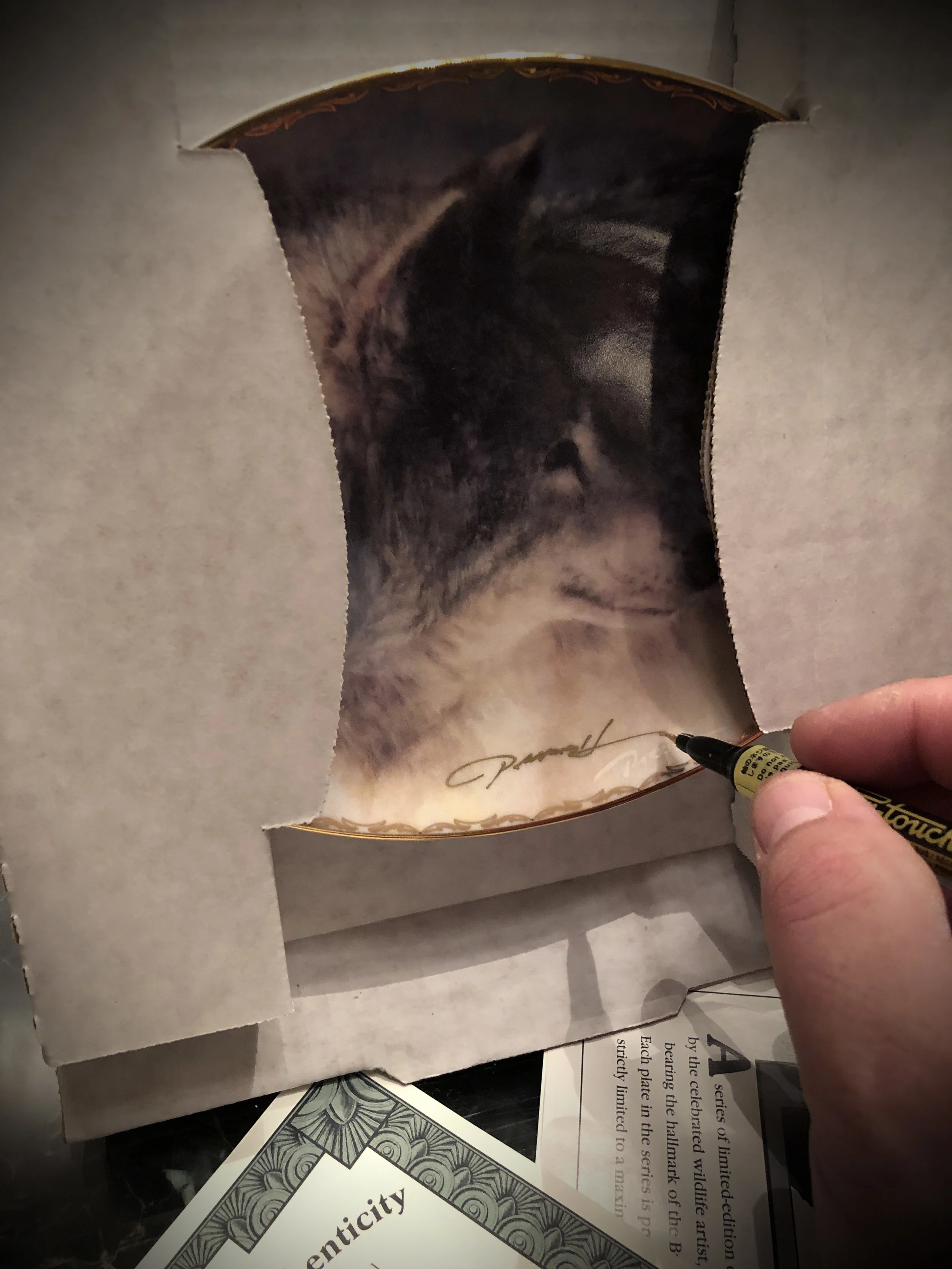 Brad Signs Each Plate.jpg