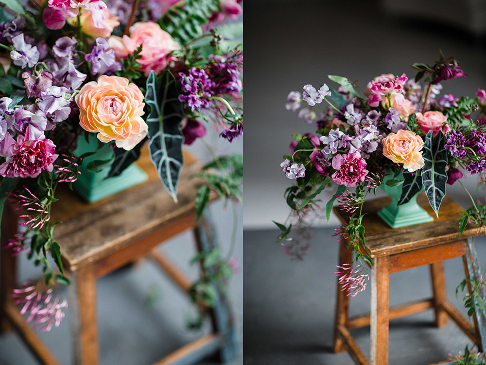  Overflowing centerpiece with purple Japanese scabiosa, purple hellebores, Silvery Moon Japanese sweet pea, Charlotte ranunculus, peach ranunculus, jasmine vine, blue star fern and Alocasia ‘Polly’, in a vintage mint footed bowl.&nbsp;&nbsp;Images by