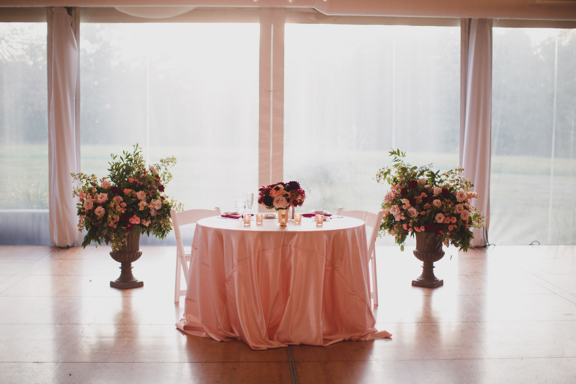 Altar arrangements repurposed to sweet heart table at wedding reception at Pinecroft Mansion, Cincinnati, Ohio. Flowers by Floral Verde LLC. Photo by Carly Short Photography.